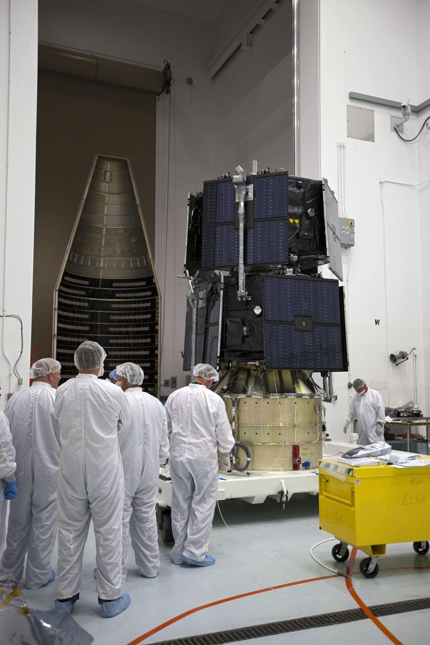TITUSVILLE, Fla. - Inside the Astrotech payload processing facility in Titusville, Fla. near NASA’s Kennedy Space Center, technicians prepare the two Radiation Belt Storm Probes, or RBSP, spacecraft prior for encapsulation in the payload faring. The fairing will house and protect the RBSP during liftoff and flight through the atmosphere aboard an Atlas V rocket. NASA’s RBSP mission will help us understand the sun’s influence on Earth and near-Earth space by studying the Earth’s radiation belts on various scales of space and time. RBSP will begin its mission of exploration of Earth’s Van Allen radiation belts and the extremes of space weather after its liftoff aboard a United Launch Alliance Atlas V from Space Launch Complex 41 at Cape Canaveral Air Force Station, Fla. Liftoff is targeted for Aug. 23, 2012. For more information, visit http://www.nasa.gov/rbsp. Photo credit: NASA/ Kim Shiflett