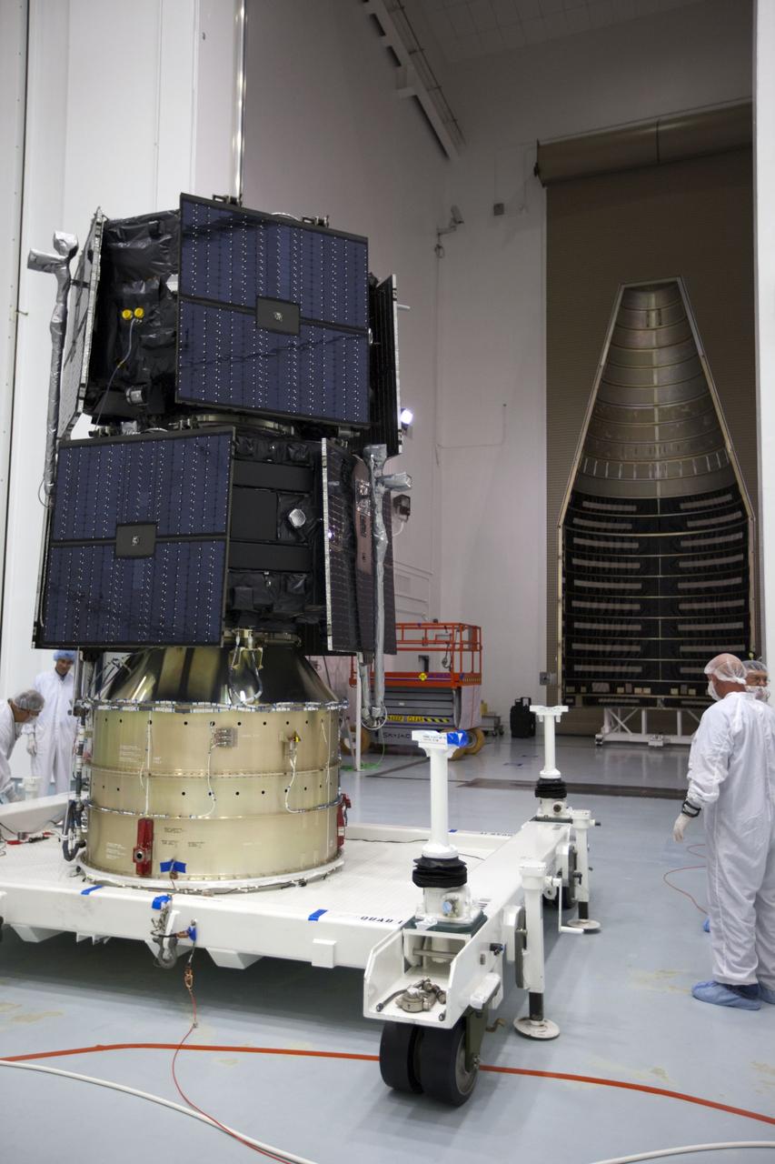 TITUSVILLE, Fla. - Inside the Astrotech payload processing facility in Titusville, Fla. near NASA’s Kennedy Space Center, technicians prepare the two Radiation Belt Storm Probes, or RBSP, spacecraft prior for encapsulation in the payload faring. The fairing will house and protect the RBSP during liftoff and flight through the atmosphere aboard an Atlas V rocket. NASA’s RBSP mission will help us understand the sun’s influence on Earth and near-Earth space by studying the Earth’s radiation belts on various scales of space and time. RBSP will begin its mission of exploration of Earth’s Van Allen radiation belts and the extremes of space weather after its liftoff aboard a United Launch Alliance Atlas V from Space Launch Complex 41 at Cape Canaveral Air Force Station, Fla. Liftoff is targeted for Aug. 23, 2012. For more information, visit http://www.nasa.gov/rbsp. Photo credit: NASA/ Kim Shiflett