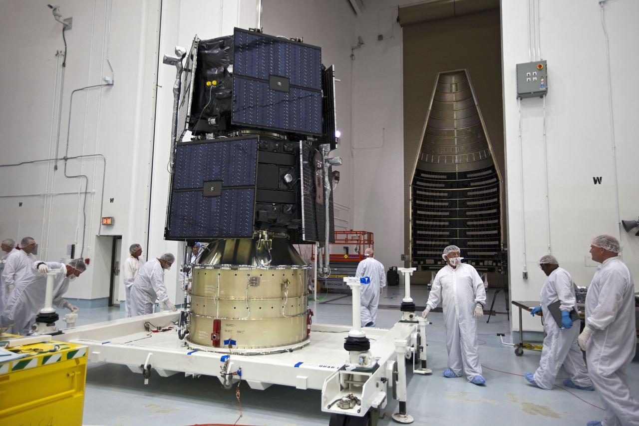 TITUSVILLE, Fla. - Inside the Astrotech payload processing facility in Titusville, Fla. near NASA’s Kennedy Space Center, technicians prepare the two Radiation Belt Storm Probes, or RBSP, spacecraft prior for encapsulation in payload faring. The fairing will house and protect the RBSP during liftoff and flight through the atmosphere aboard an Atlas V rocket. NASA’s RBSP mission will help us understand the sun’s influence on Earth and near-Earth space by studying the Earth’s radiation belts on various scales of space and time. RBSP will begin its mission of exploration of Earth’s Van Allen radiation belts and the extremes of space weather after its liftoff aboard a United Launch Alliance Atlas V from Space Launch Complex 41 at Cape Canaveral Air Force Station, Fla. Liftoff is targeted for Aug. 23, 2012. For more information, visit http://www.nasa.gov/rbsp. Photo credit: NASA/ Kim Shiflett