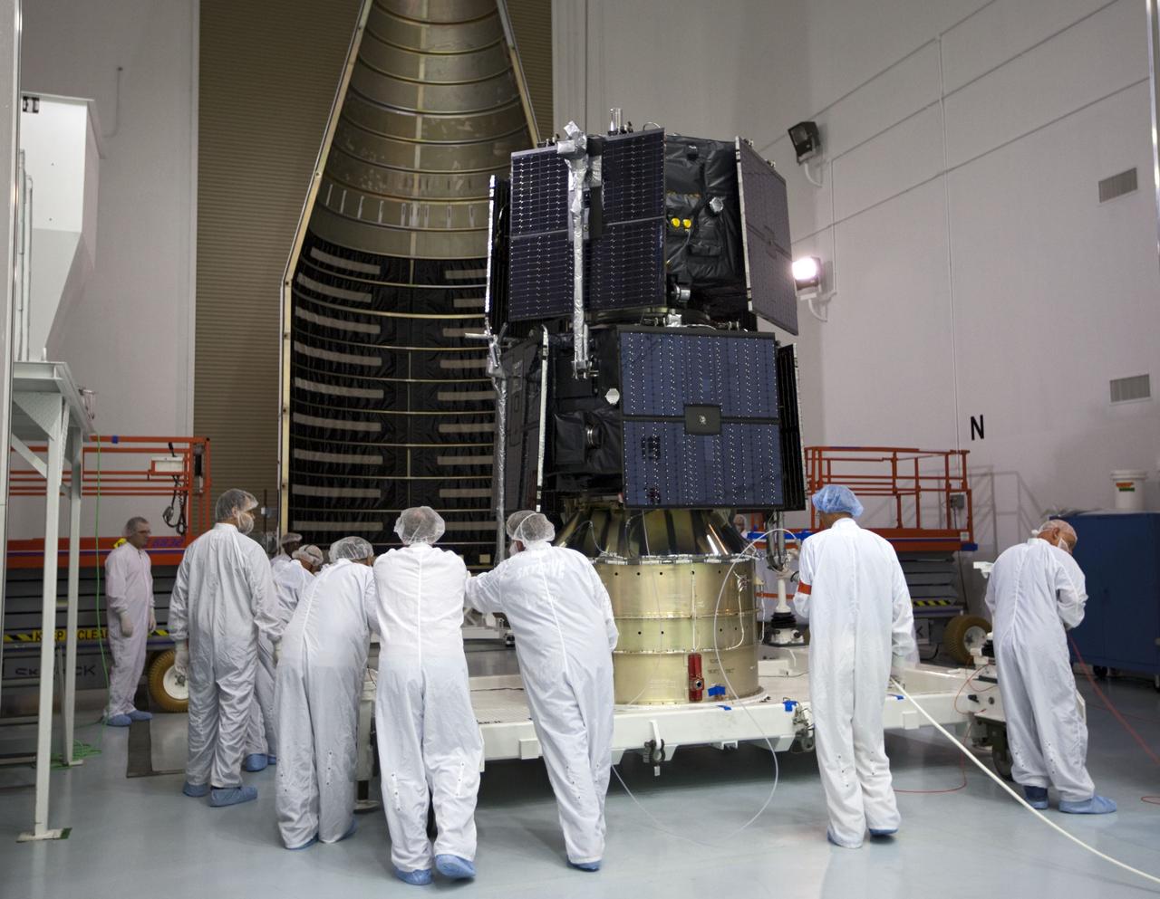 TITUSVILLE, Fla. - Inside the Astrotech payload processing facility in Titusville, Fla. near NASA’s Kennedy Space Center, technicians move the two Radiation Belt Storm Probes, or RBSP, spacecraft into position for encapsulation in the payload faring. The fairing will house and protect the RBSP during liftoff and flight through the atmosphere aboard an Atlas V rocket. NASA’s RBSP mission will help us understand the sun’s influence on Earth and near-Earth space by studying the Earth’s radiation belts on various scales of space and time. RBSP will begin its mission of exploration of Earth’s Van Allen radiation belts and the extremes of space weather after its liftoff aboard a United Launch Alliance Atlas V from Space Launch Complex 41 at Cape Canaveral Air Force Station, Fla. Liftoff is targeted for Aug. 23, 2012. For more information, visit http://www.nasa.gov/rbsp. Photo credit: NASA/ Kim Shiflett