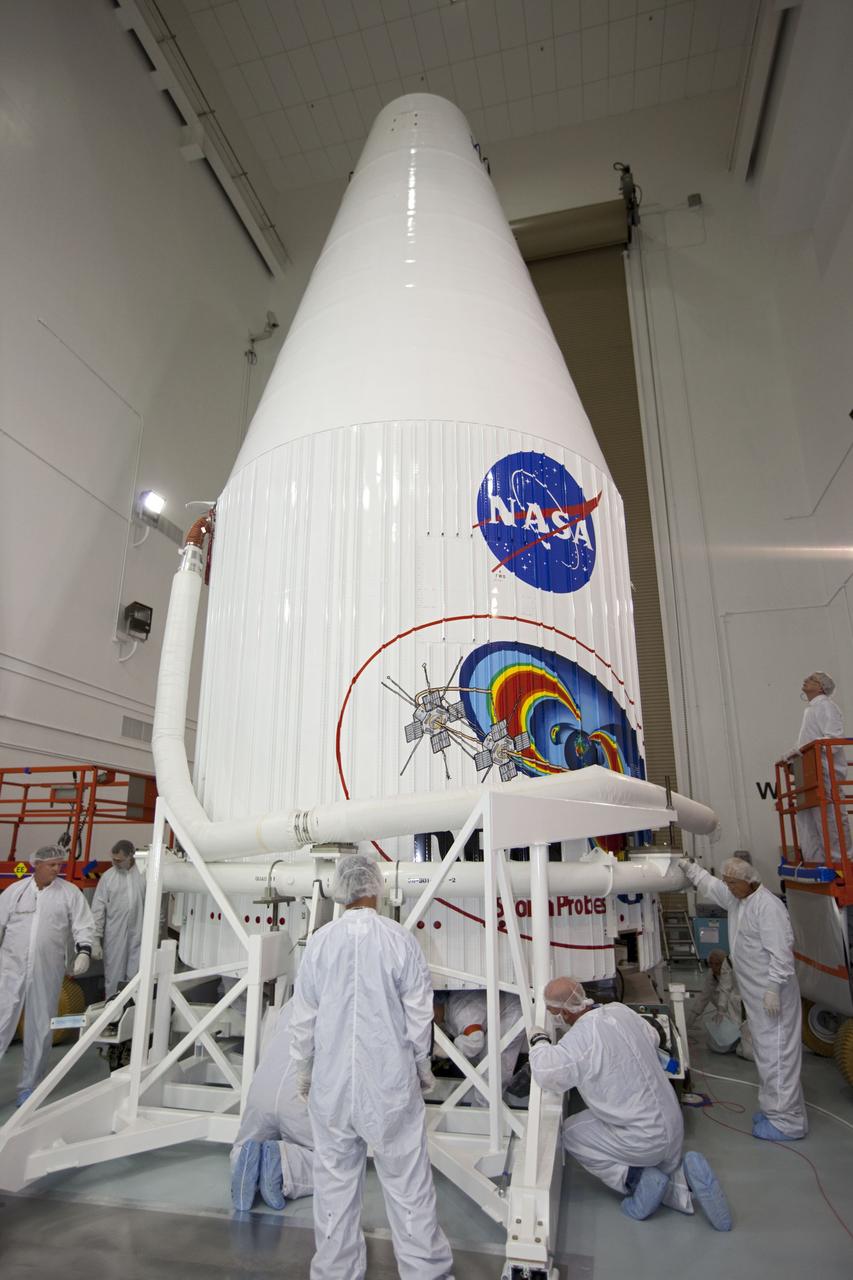 TITUSVILLE, Fla. - Inside the Astrotech payload processing facility in Titusville, Fla. near NASA’s Kennedy Space Center, technicians complete encapsulation of the two Radiation Belt Storm Probes, or RBSP, spacecraft with its payload faring. The fairing will house and protect the RBSP during liftoff and flight through the atmosphere aboard an Atlas V rocket. NASA’s RBSP mission will help us understand the sun’s influence on Earth and near-Earth space by studying the Earth’s radiation belts on various scales of space and time. RBSP will begin its mission of exploration of Earth’s Van Allen radiation belts and the extremes of space weather after its liftoff aboard a United Launch Alliance Atlas V from Space Launch Complex 41 at Cape Canaveral Air Force Station, Fla. Liftoff is targeted for Aug. 23, 2012. For more information, visit http://www.nasa.gov/rbsp. Photo credit: NASA/ Kim Shiflett