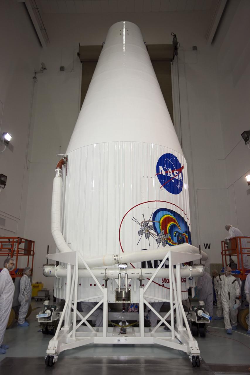 TITUSVILLE, Fla. - Inside the Astrotech payload processing facility in Titusville, Fla. near NASA’s Kennedy Space Center, technicians complete encapsulation of the two Radiation Belt Storm Probes, or RBSP, spacecraft with its payload faring. The fairing will house and protect the RBSP during liftoff and flight through the atmosphere aboard an Atlas V rocket. NASA’s RBSP mission will help us understand the sun’s influence on Earth and near-Earth space by studying the Earth’s radiation belts on various scales of space and time. RBSP will begin its mission of exploration of Earth’s Van Allen radiation belts and the extremes of space weather after its liftoff aboard a United Launch Alliance Atlas V from Space Launch Complex 41 at Cape Canaveral Air Force Station, Fla. Liftoff is targeted for Aug. 23, 2012. For more information, visit http://www.nasa.gov/rbsp. Photo credit: NASA/ Kim Shiflett