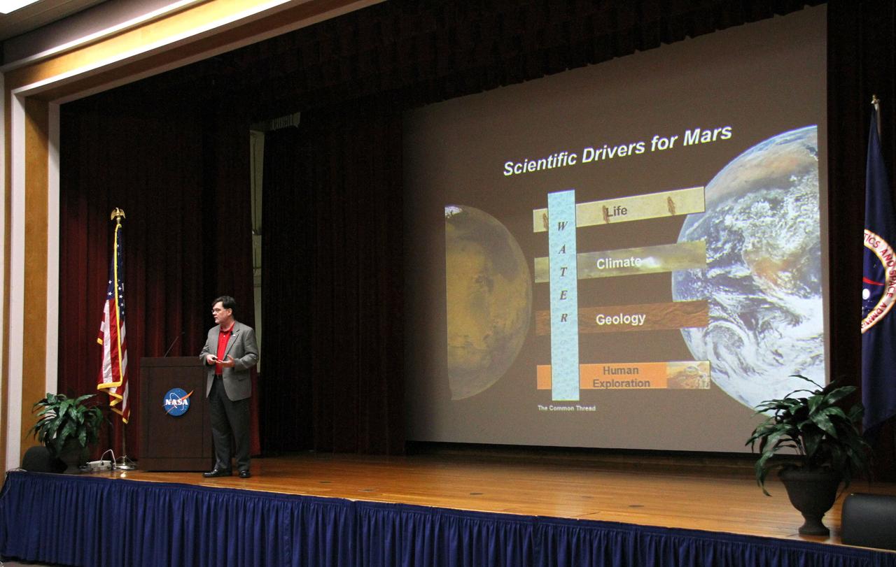 CAPE CANAVERAL, Fla. –Jim Adams, NASA's deputy chief technologist, discusses the successful landing of the Mars Science Laboratory rover Curiosity on Mars during a session with NASA's Kennedy Space Center employees in the training auditorium at the center. Photo credit: NASA/Cory Huston