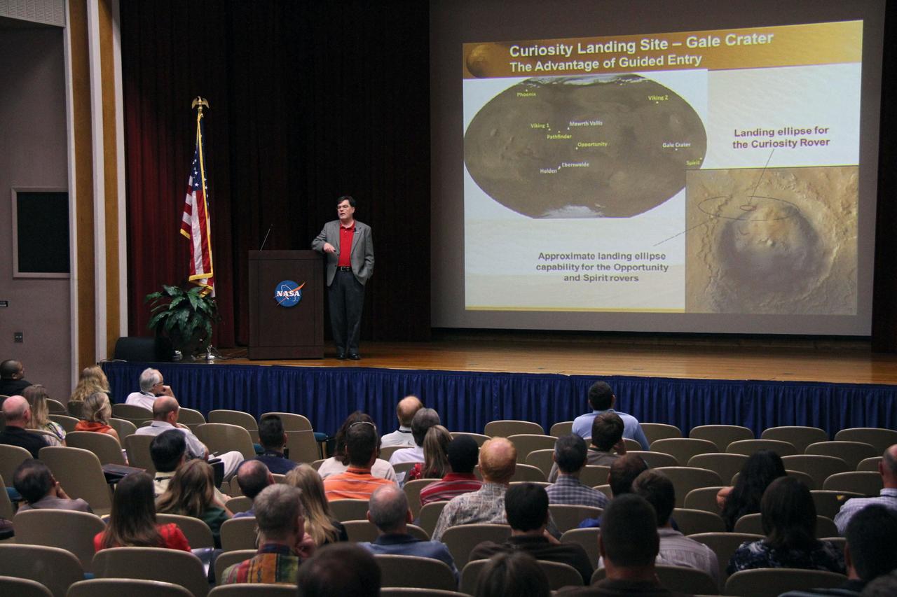 CAPE CANAVERAL, Fla. –Jim Adams, NASA's deputy chief technologist, discusses the successful landing of the Mars Science Laboratory rover Curiosity on Mars during a session with NASA's Kennedy Space Center employees in the training auditorium at the center. Photo credit: NASA/Cory Huston