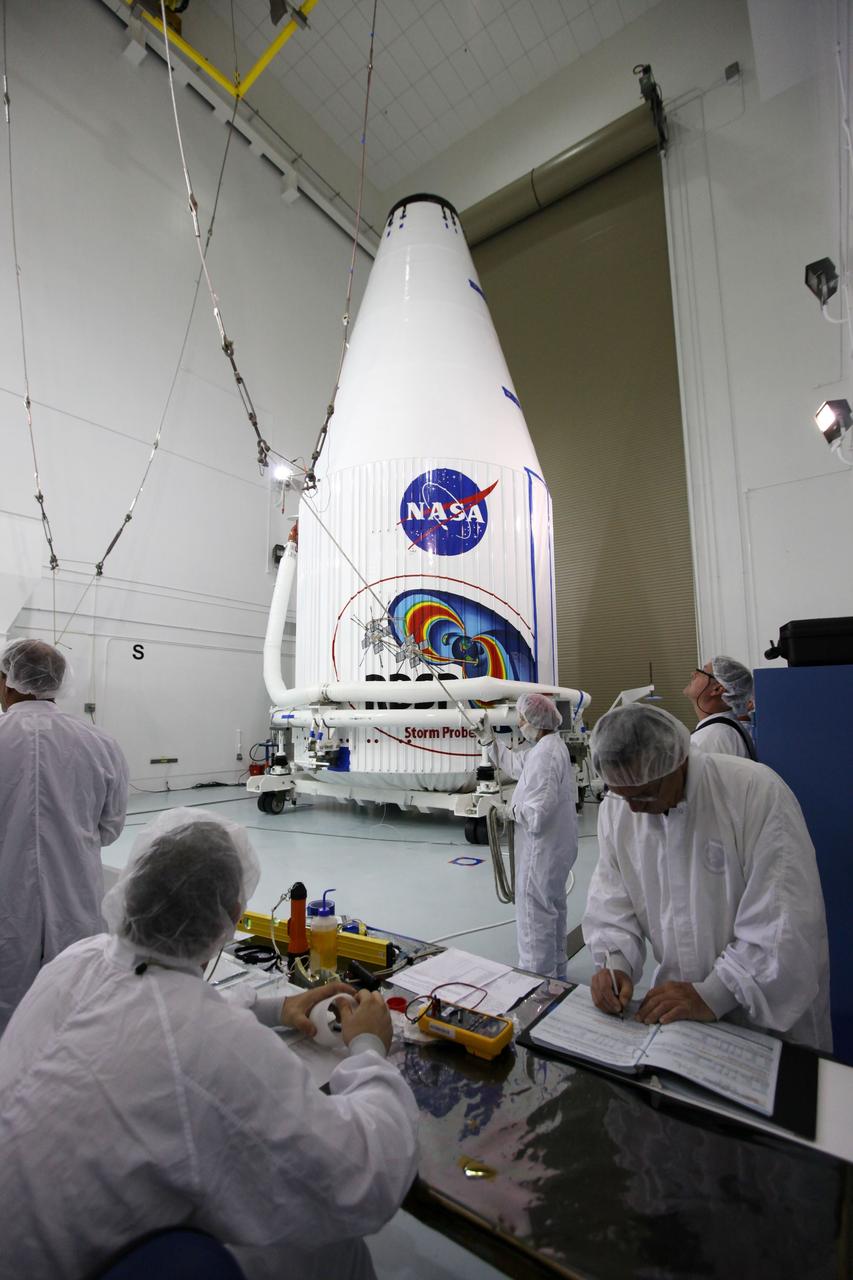 TITUSVILLE, Fla. - Inside the Astrotech payload processing facility in Titusville, Fla. near NASA’s Kennedy Space Center, technicians make final checks prior to lifting the payload faring containing the two Radiation Belt Storm Probes, or RBSP, spacecraft on to a transporter to be moved to the launch complex. NASA’s RBSP mission will help us understand the sun’s influence on Earth and near-Earth space by studying the Earth’s radiation belts on various scales of space and time. RBSP will begin its mission of exploration of Earth’s Van Allen radiation belts and the extremes of space weather after its liftoff aboard a United Launch Alliance Atlas V rocket from Space Launch Complex 41 at Cape Canaveral Air Force Station, Fla. Liftoff is targeted for Aug. 23, 2012. For more information, visit http://www.nasa.gov/rbsp Photo credit: NASA/ Kim Shiflett