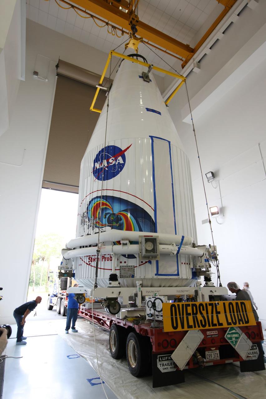 TITUSVILLE, Fla. - Inside the Astrotech payload processing facility in Titusville, Fla. near NASA’s Kennedy Space Center, technicians use a crane to lower the payload faring containing the two Radiation Belt Storm Probes, or RBSP, spacecraft on to a transporter to be moved to the launch complex. NASA’s RBSP mission will help us understand the sun’s influence on Earth and near-Earth space by studying the Earth’s radiation belts on various scales of space and time. RBSP will begin its mission of exploration of Earth’s Van Allen radiation belts and the extremes of space weather after its liftoff aboard a United Launch Alliance Atlas V rocket from Space Launch Complex 41 at Cape Canaveral Air Force Station, Fla. Liftoff is targeted for Aug. 23, 2012. For more information, visit http://www.nasa.gov/rbsp Photo credit: NASA/ Kim Shiflett