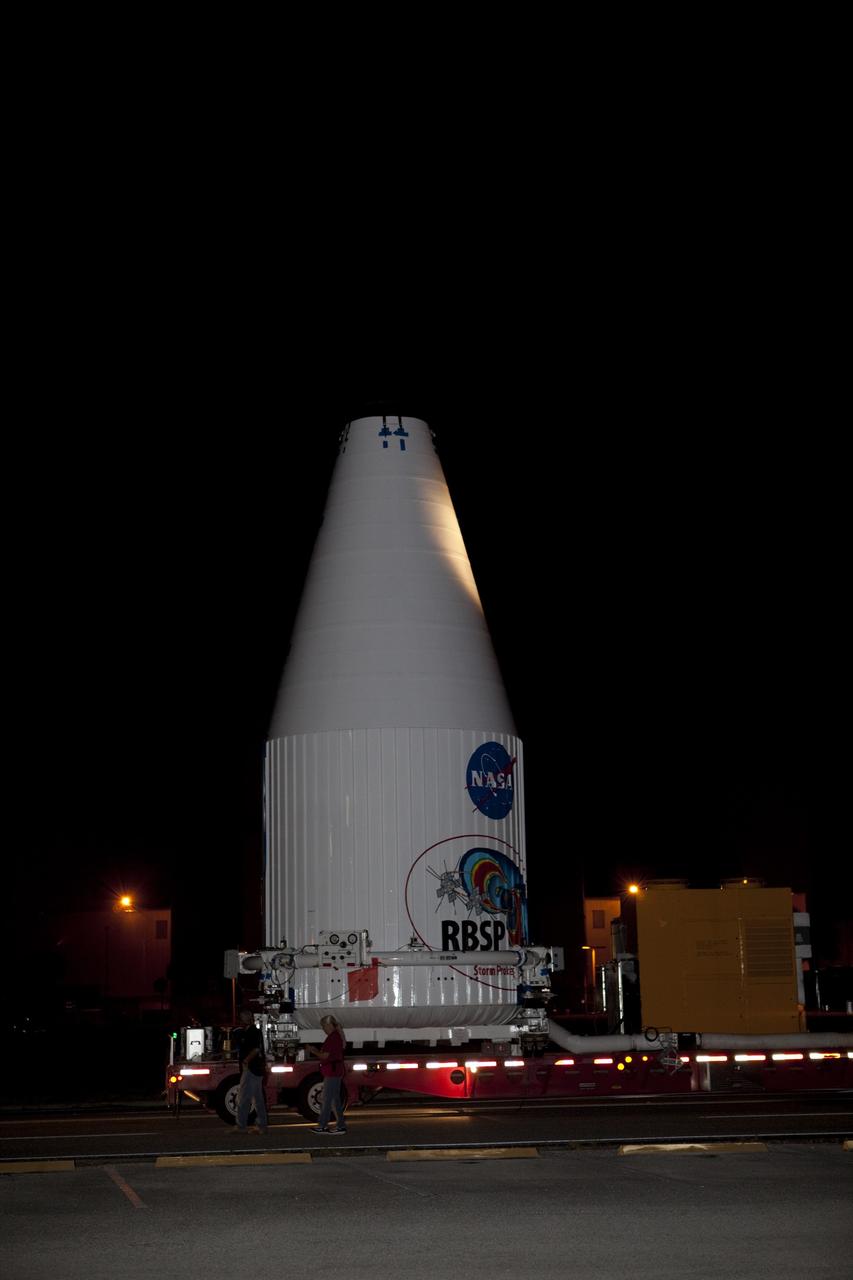 CAPE CANAVERAL, Fla. – The Radiation Belt Storm Probes, or RBSP, spacecraft are moved inside their payload fairing on the payload transporter from the Astrotech payload processing facility in Titusville, Fla. to Space Launch Complex-41 at Cape Canaveral Air Force Station. The fairing, which holds the twin RBSP spacecraft, will be lifted to the top of a United Launch Alliance Atlas V rocket for launch later in August. The two spacecraft are designed to study the Van Allen radiation belts in unprecedented detail. Photo credit: NASA/Dmitri Gerondidakis