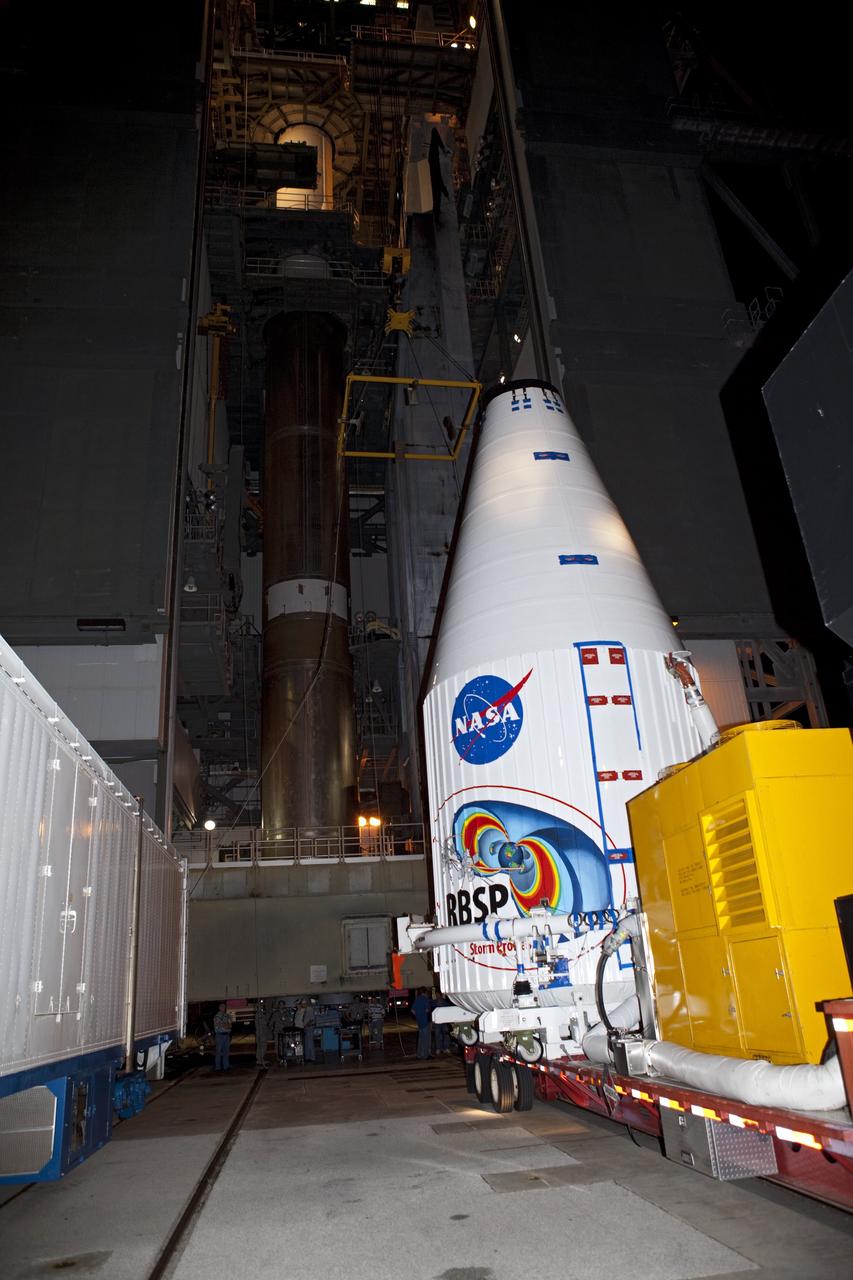 CAPE CANAVERAL, Fla. – The Radiation Belt Storm Probes, or RBSP, spacecraft arrive at Space Launch Complex-41 at Cape Canaveral Air Force Station inside their payload fairing. The twin spacecraft were moved on the payload transporter from the Astrotech payload processing facility in Titusville, Fla. The fairing with the spacecraft inside will be lifted to the top of a United Launch Alliance Atlas V rocket for launch later in August. The two spacecraft are designed to study the Van Allen radiation belts in unprecedented detail. Photo credit: NASA/Dmitri Gerondidakis