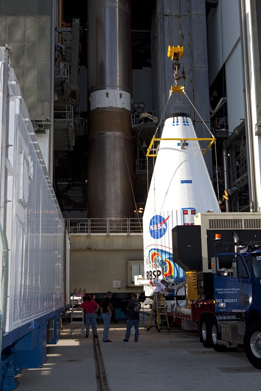CAPE CANAVERAL, Fla. – Technicians prepare to hoist the Radiation Belt Storm Probes, or RBSP, spacecraft inside their payload fairing to the top of a United Launch Alliance Atlas V rocket at Space Launch Complex-41 at Cape Canaveral Air Force Station. The two spacecraft are designed to study the Van Allen radiation belts in unprecedented detail. Photo credit: NASA/Dmitri Gerondidakis