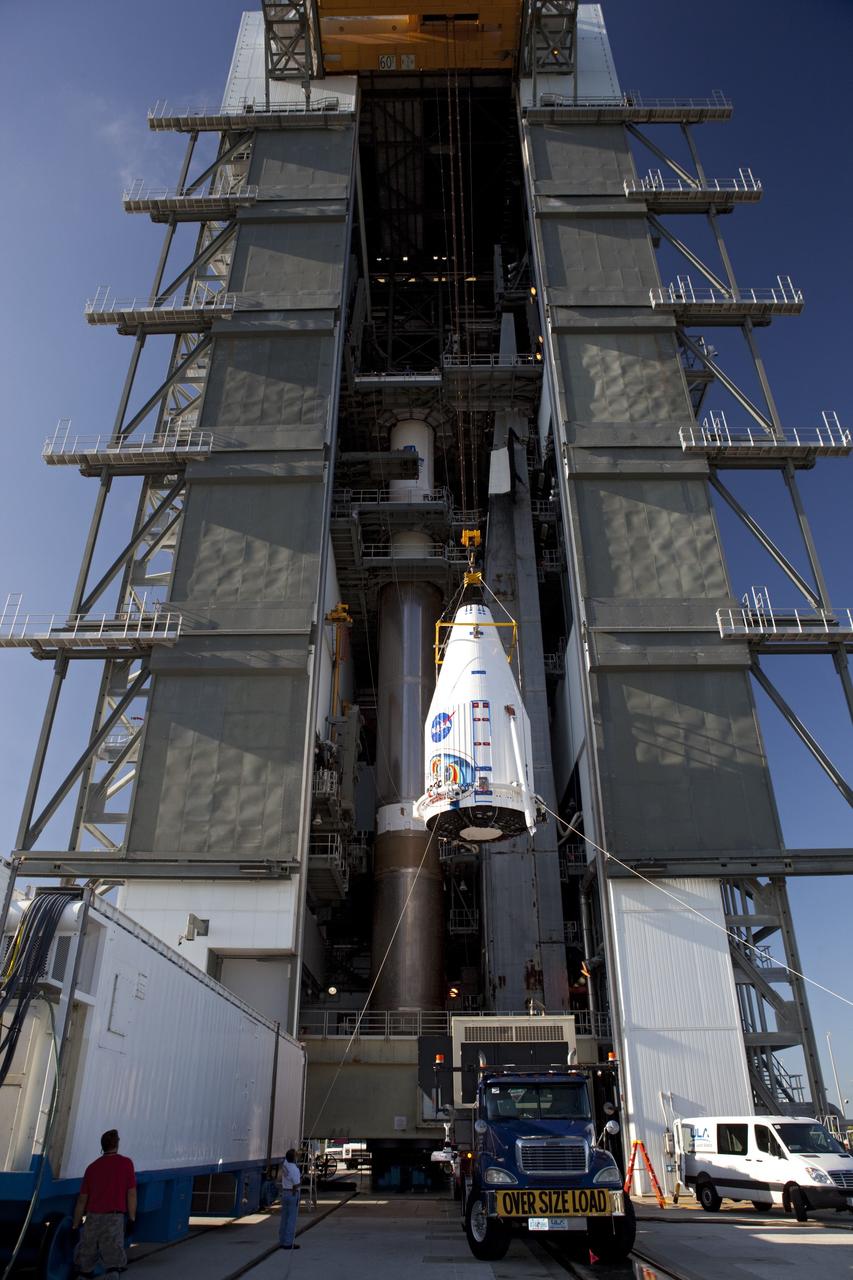 CAPE CANAVERAL, Fla. – Technicians hoist the Radiation Belt Storm Probes, or RBSP, spacecraft inside their payload fairing to the top of a United Launch Alliance Atlas V rocket at Space Launch Complex-41 at Cape Canaveral Air Force Station. The two spacecraft are designed to study the Van Allen radiation belts in unprecedented detail. Photo credit: NASA/Dmitri Gerondidakis