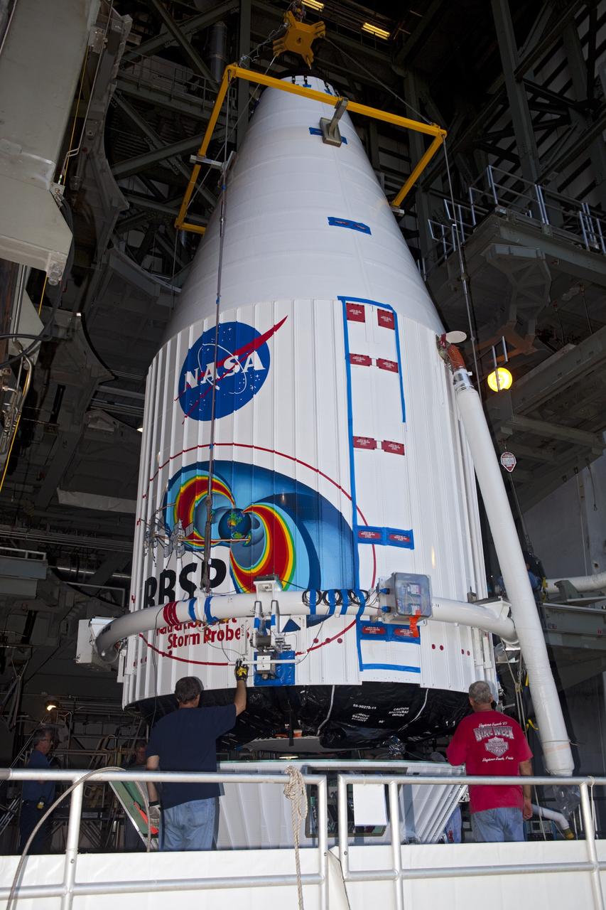 CAPE CANAVERAL, Fla. – Technicians attach the payload fairing holding the Radiation Belt Storm Probes, or RBSP, spacecraft to the top of a United Launch Alliance Atlas V rocket at Space Launch Complex-41 at Cape Canaveral Air Force Station. The two spacecraft are designed to study the Van Allen radiation belts in unprecedented detail. Photo credit: NASA/Dmitri Gerondidakis