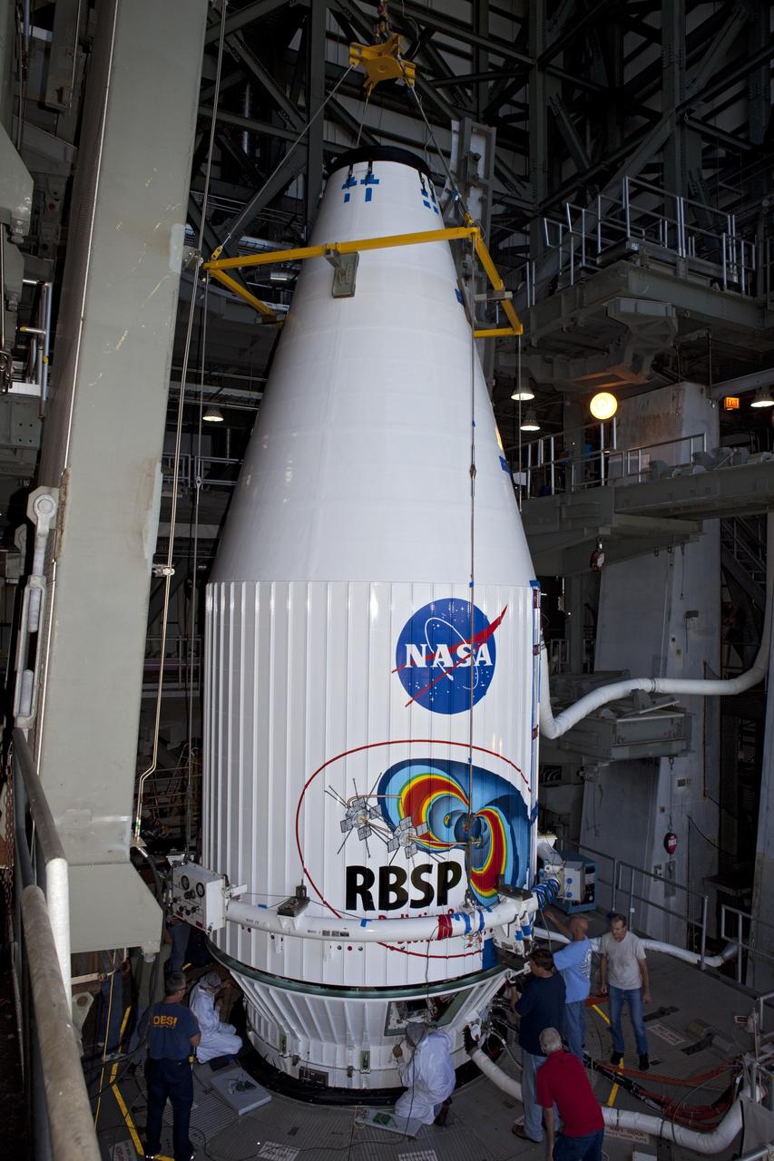CAPE CANAVERAL, Fla. – Technicians attach the payload fairing holding the Radiation Belt Storm Probes, or RBSP, spacecraft to the top of a United Launch Alliance Atlas V rocket at Space Launch Complex-41 at Cape Canaveral Air Force Station. The two spacecraft are designed to study the Van Allen radiation belts in unprecedented detail. Photo credit: NASA/Dmitri Gerondidakis