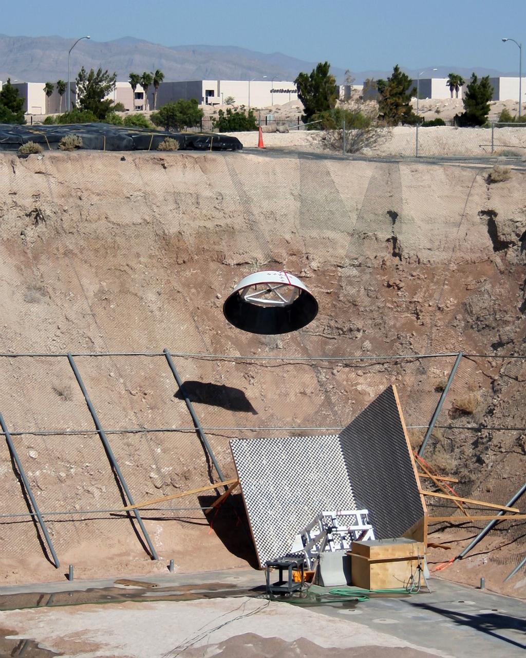 LAS VEGAS -- The Boeing Company tests the forward heat shield FHS jettison system of its CST-100 spacecraft at the Bigelow Aerospace facility in Las Vegas as part of an agreement with NASA's Commercial Crew Program CCP during Commercial Crew Development Round 2 CCDev2) activities. The FHS will protect the spacecraft's parachutes, rendezvous-and-docking sensor packages, and docking mechanism during ascent and re-entry. During a mission to low Earth orbit, the shield will be jettisoned after re-entry heating, allowing the spacecraft's air bags to deploy for a safe landing. In 2011, NASA selected Boeing for CCDev2 to mature the design and development of a crew transportation system with the overall goal of accelerating a United States-led capability to the International Space Station. The goal of CCP is to drive down the cost of space travel as well as open up space to more people than ever before by balancing industry’s own innovative capabilities with NASA's 50 years of human spaceflight experience. Six other aerospace companies also were selected to mature launch vehicle and spacecraft designs under CCDev2, including Alliant Techsystems Inc. ATK, Excalibur Almaz Inc., Blue Origin, Sierra Nevada Corp. SNC, Space Exploration Technologies SpaceX, and United Launch Alliance ULA. For more information, visit www.nasa.gov/commercialcrew. Image credit: Boeing    The Ground Systems Development and Operations Program is developing the necessary ground systems, infrastructure and operational approaches required to safely process, assemble, transport and launch the next generation of rockets and spacecraft in support of NASA’s exploration objectives. Future work also will replace the antiquated communications, power and vehicle access resources with modern efficient systems. Some of the utilities and systems slated for replacement have been used since the VAB opened in 1965. For more information, visit http://www.nasa.gov/exploration/systems/ground/index.html Photo credit: Boeing