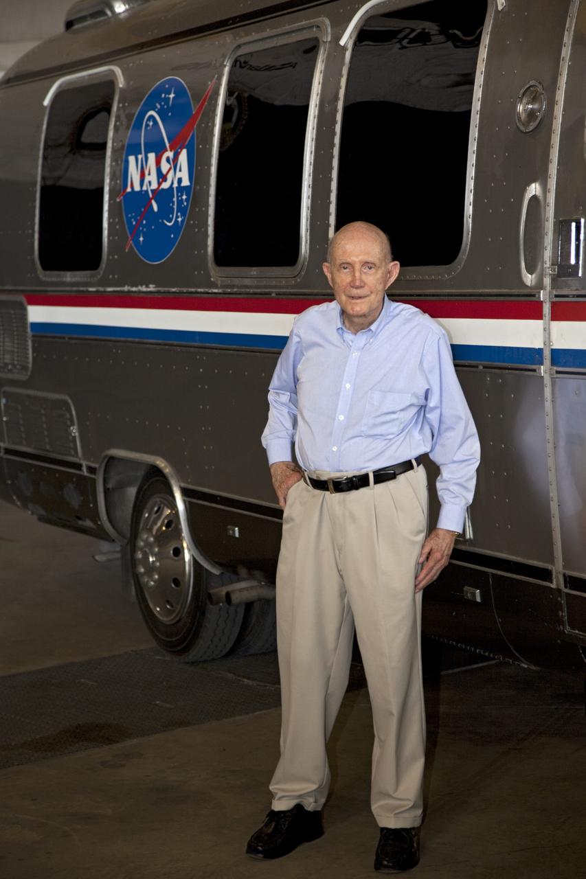 CAPE CANAVERAL, Fla. – Lt. Gen. Thomas P. Stafford, former astronaut and Air Force test pilot, stands near the Astrovan and space shuttle Atlantis inside the Vehicle Assembly Building at NASA's Kennedy Space Center in Florida. Stafford flew two Gemini missions, commanded Apollo 10 and commanded the Apollo-Soyuz test mission during his NASA career. Photo credit: NASA/Frankie Martin