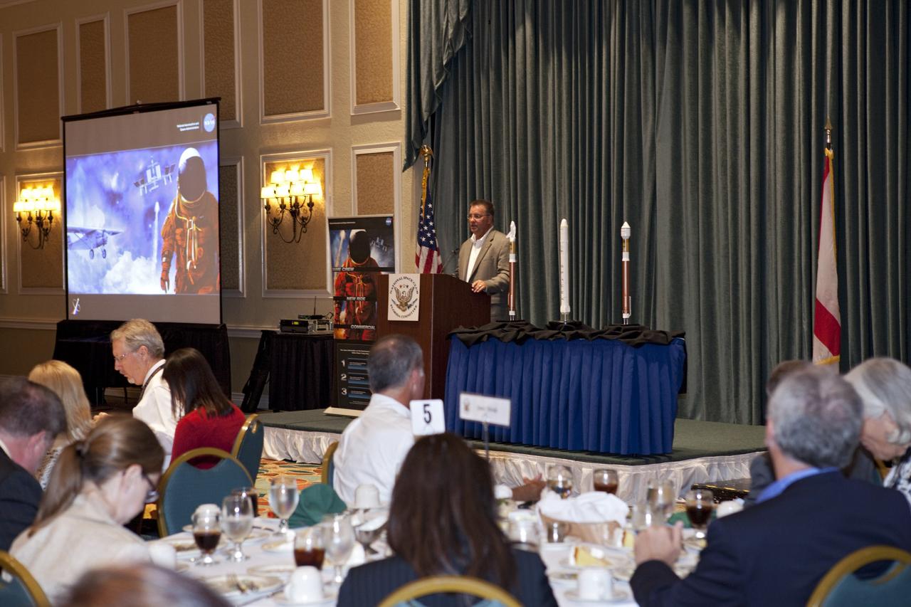 CAPE CANAVERAL, Fla. -- At the National Space Club Florida Committee's August luncheon at the Radisson Resort at the Port in Cape Canaveral, Fla., NASA Commercial Crew Program Manager Ed Mango discusses the innovative steps the agency is taking with industry partners to develop the next U.S. space transportation capability to and from low Earth orbit, which will eventually be available for use by the U.S. government and other commercial customers. To learn more about the Commercial Crew Program, visit www.nasa.gov/commercialcrew. Photo credit: Kim Shiflett