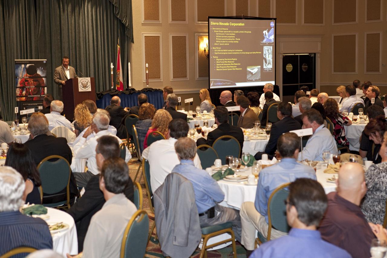 CAPE CANAVERAL, Fla. -- At the National Space Club Florida Committee's August luncheon at the Radisson Resort at the Port in Cape Canaveral, Fla., NASA Commercial Crew Program Manager Ed Mango discusses the innovative steps the agency is taking with industry partners to develop the next U.S. space transportation capability to and from low Earth orbit, which will eventually be available for use by the U.S. government and other commercial customers. To learn more about the Commercial Crew Program, visit www.nasa.gov/commercialcrew. Photo credit: Kim Shiflett