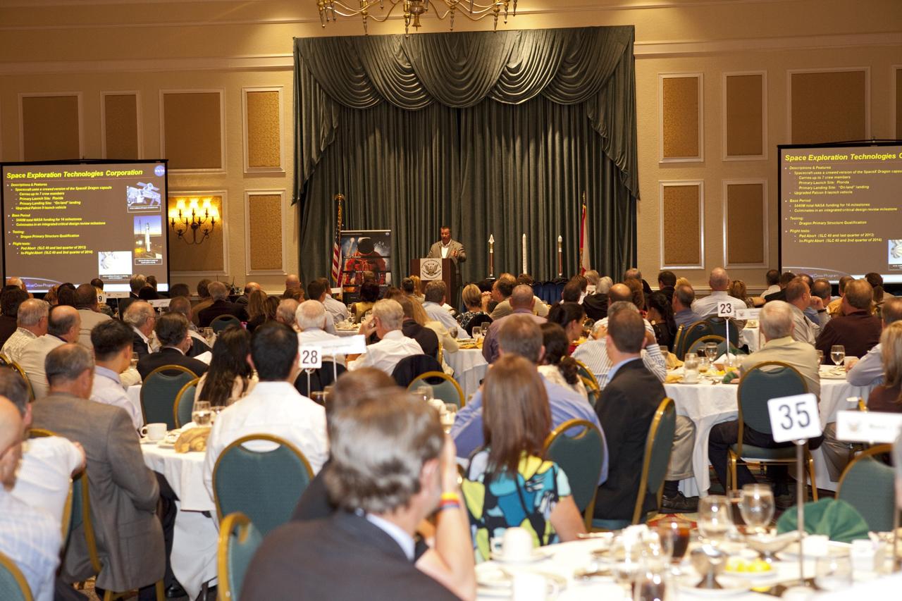 CAPE CANAVERAL, Fla. -- At the National Space Club Florida Committee's August luncheon at the Radisson Resort at the Port in Cape Canaveral, Fla., NASA Commercial Crew Program Manager Ed Mango discusses the innovative steps the agency is taking with industry partners to develop the next U.S. space transportation capability to and from low Earth orbit, which will eventually be available for use by the U.S. government and other commercial customers. To learn more about the Commercial Crew Program, visit www.nasa.gov/commercialcrew. Photo credit: Kim Shiflett