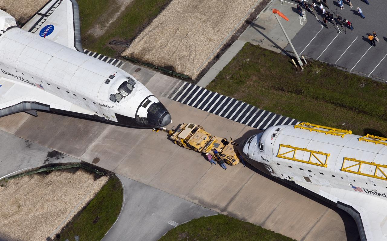 CAPE CANAVERAL, Fla. – Space shuttles Endeavour and Atlantis are parked nose-to-nose for a brief photo opportunity. The shuttles are switching locations at NASA's Kennedy Space Center in Florida. Endeavour backed out of Bay 2 of the Orbiter Processing Facility and Atlantis moved out of the Vehicle Assembly Building VAB. Endeavour is undergoing final preparations for its cross-country ferry flight targeted for mid-September. The work is part of Transition and Retirement of the remaining space shuttles, Endeavour and Atlantis. Endeavour is being prepared for public display at the California Science Center in Los Angeles. Endeavour was the last space shuttle added to NASA’s orbiter fleet. Over the course of its 19-year career, Endeavour spent 299 days in space during 25 missions. For more information, visit http://www.nasa.gov/transition Photo credit: NASA/ Frankie Martin
