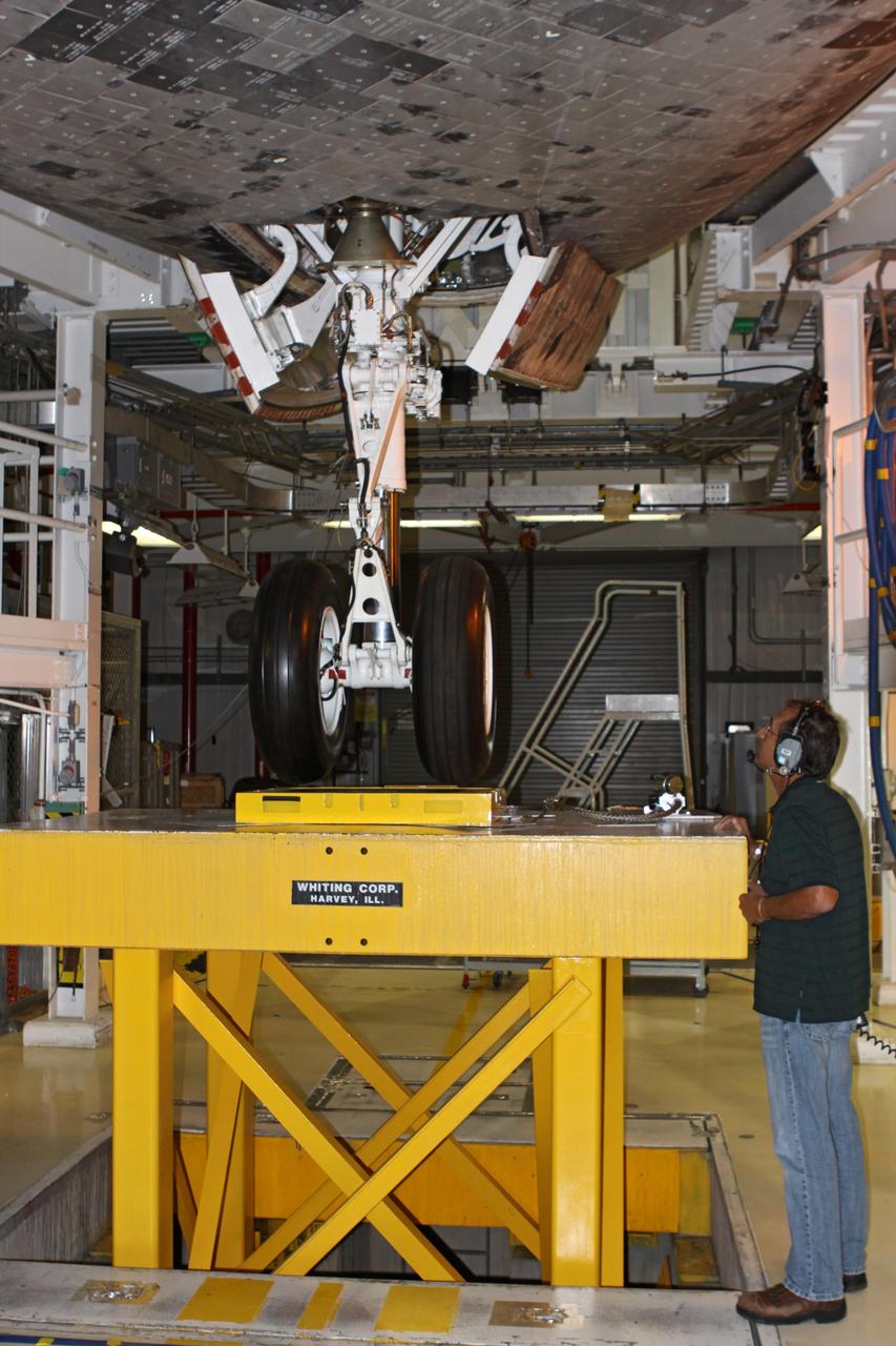 CAPE CANAVERAL, Fla. – In Orbiter Processing Facility Bay 2 at NASA’s Kennedy Space Center in Florida, a United Space Alliance technician monitors the nose landing gear during weight and center of gravity checks on the space shuttle Endeavour.      The work is part of Transition and Retirement of the remaining space shuttles, Endeavour and Atlantis. Endeavour is being prepared for public display at the California Science Center in Los Angeles. Its ferry flight to California is targeted for mid-September. Endeavour was the last space shuttle added to NASA’s orbiter fleet. Over the course of its 19-year career, Endeavour spent 299 days in space during 25 missions. For more information, visit http://www.nasa.gov/transition Photo credit: NASA/ Jim Grossmann