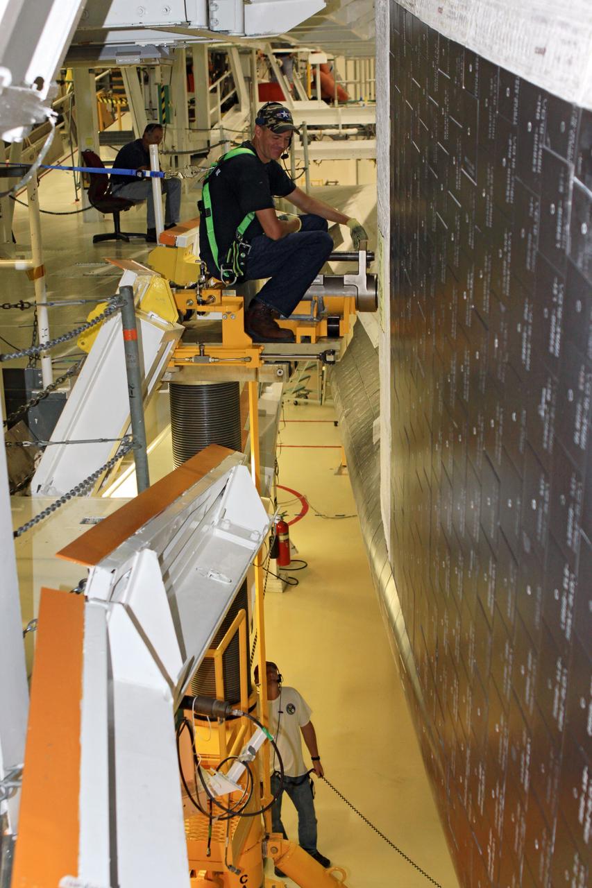 CAPE CANAVERAL, Fla. – While wearing a safety harness, United Space Alliance aerospace technician Greg Smith checks equipment during weight and center of gravity checks on the space shuttle Endeavour in Bay 2 of the Orbiter Processing Facility at NASA’s Kennedy Space Center in Florida. The work is part of Transition and Retirement of the remaining space shuttles, Endeavour and Atlantis. Endeavour is being prepared for public display at the California Science Center in Los Angeles. Its ferry flight to California is targeted for mid-September. Endeavour was the last space shuttle added to NASA’s orbiter fleet. Over the course of its 19-year career, Endeavour spent 299 days in space during 25 missions. For more information, visit http://www.nasa.gov/transition Photo credit: NASA/ Jim Grossmann