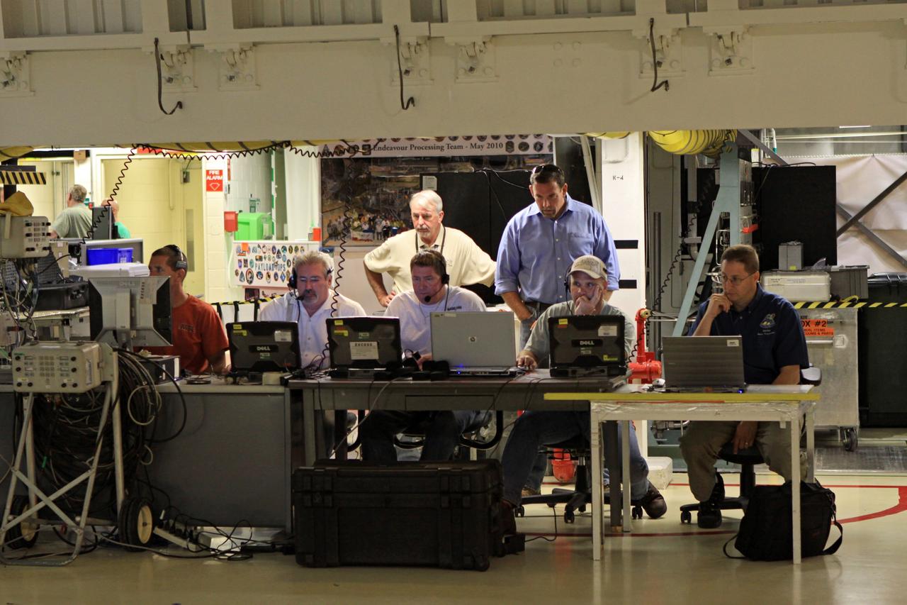 CAPE CANAVERAL, Fla. – In Orbiter Processing Facility OPF Bay 2 at NASA’s Kennedy Space Center in Florida, weight and center of gravity checks are underway on the space shuttle Endeavour. Monitoring data on the activity are United Space Alliance USA OPF Manager Mark Barnes, standing to the left, and Mike McClure, of USA Orbiter Handling Engineering. Seated, from the left, are USA move director Cliff Semonski, USA move director Mark McGee, USA lead aerospace Quality Mission Assurance inspector Jesse English, Doug Robison, of USA Orbiter Handling Engineering, and Robert Handl, of Boeing Mass Properties. The work is part of Transition and Retirement of the remaining space shuttles, Endeavour and Atlantis. Endeavour is being prepared for public display at the California Science Center in Los Angeles. Its ferry flight to California is targeted for mid-September. Endeavour was the last space shuttle added to NASA’s orbiter fleet. Over the course of its 19-year career, Endeavour spent 299 days in space during 25 missions. For more information, visit http://www.nasa.gov/transition Photo credit: NASA/ Jim Grossmann