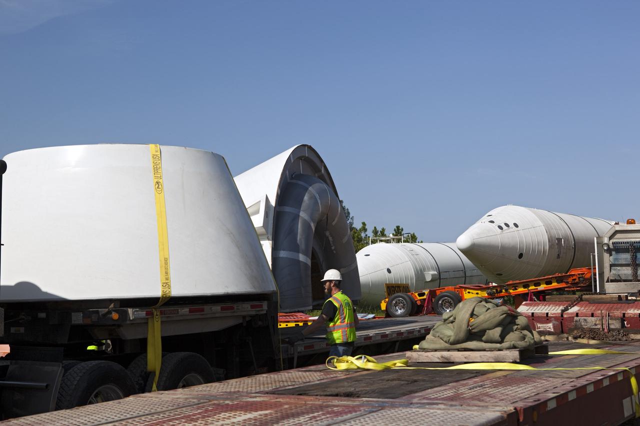 CAPE CANAVERAL, Fla. – At NASA’s Kennedy Space Center in Florida, aft skirts for space shuttle solid rocket boosters are being loaded on a truck. A twin set of space shuttle solid rocket boosters and an external fuel tank are being prepared for transport to separate museums.      The solid rocket boosters, or SRBs, will be displayed at the California Science Center in Los Angeles. The external tank soon will be transported for display at the Wings of Dreams Aviation Museum at Keystone Heights Airport between Gainesville and Jacksonville, Fla. The 149-foot SRBs together provided six million pounds of thrust. The external fuel tank contained over 500,000 gallons of liquid hydrogen and liquid oxygen propellant for the shuttle orbiters' three main engines. The work is part of Transition and Retirement of the space shuttle. For more information, visit http://www.nasa.gov/transition Photo credit: NASA/ Dimitri Gerondidakis