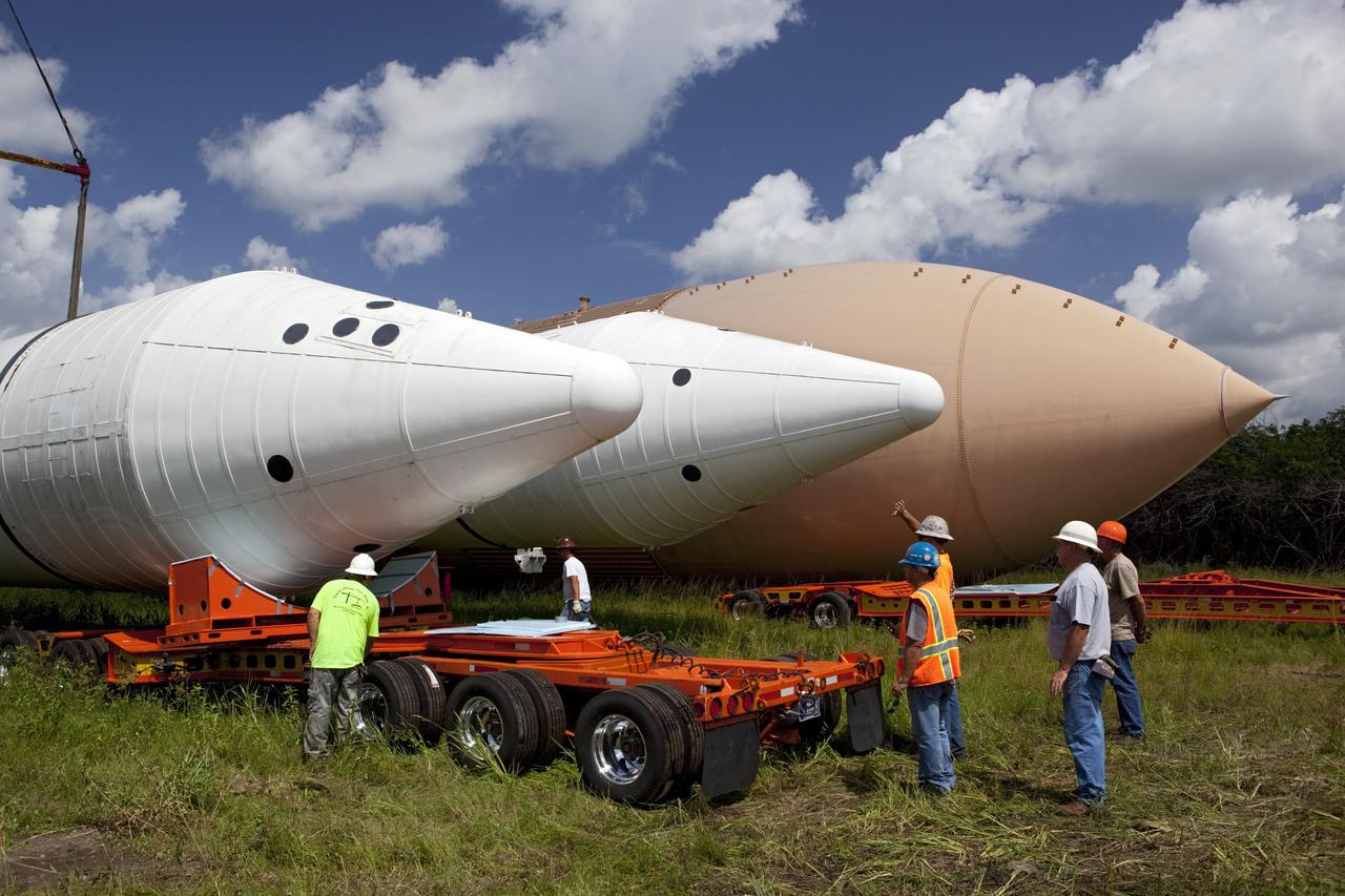 CAPE CANAVERAL, Fla. – At NASA’s Kennedy Space Center in Florida, preparations are underway to load a twin set of space shuttle solid rocket boosters and an external fuel tank on trucks for transport to separate museums.      The solid rocket boosters, or SRBs, will be displayed at the California Science Center in Los Angeles. The external tank soon will be transported for display at the Wings of Dreams Aviation Museum at Keystone Heights Airport between Gainesville and Jacksonville, Fla. The 149-foot SRBs together provided six million pounds of thrust. The external fuel tank contained over 500,000 gallons of liquid hydrogen and liquid oxygen propellant for the shuttle orbiters' three main engines. The work is part of Transition and Retirement of the space shuttle. For more information, visit http://www.nasa.gov/transition Photo credit: NASA/ Dimitri Gerondidakis