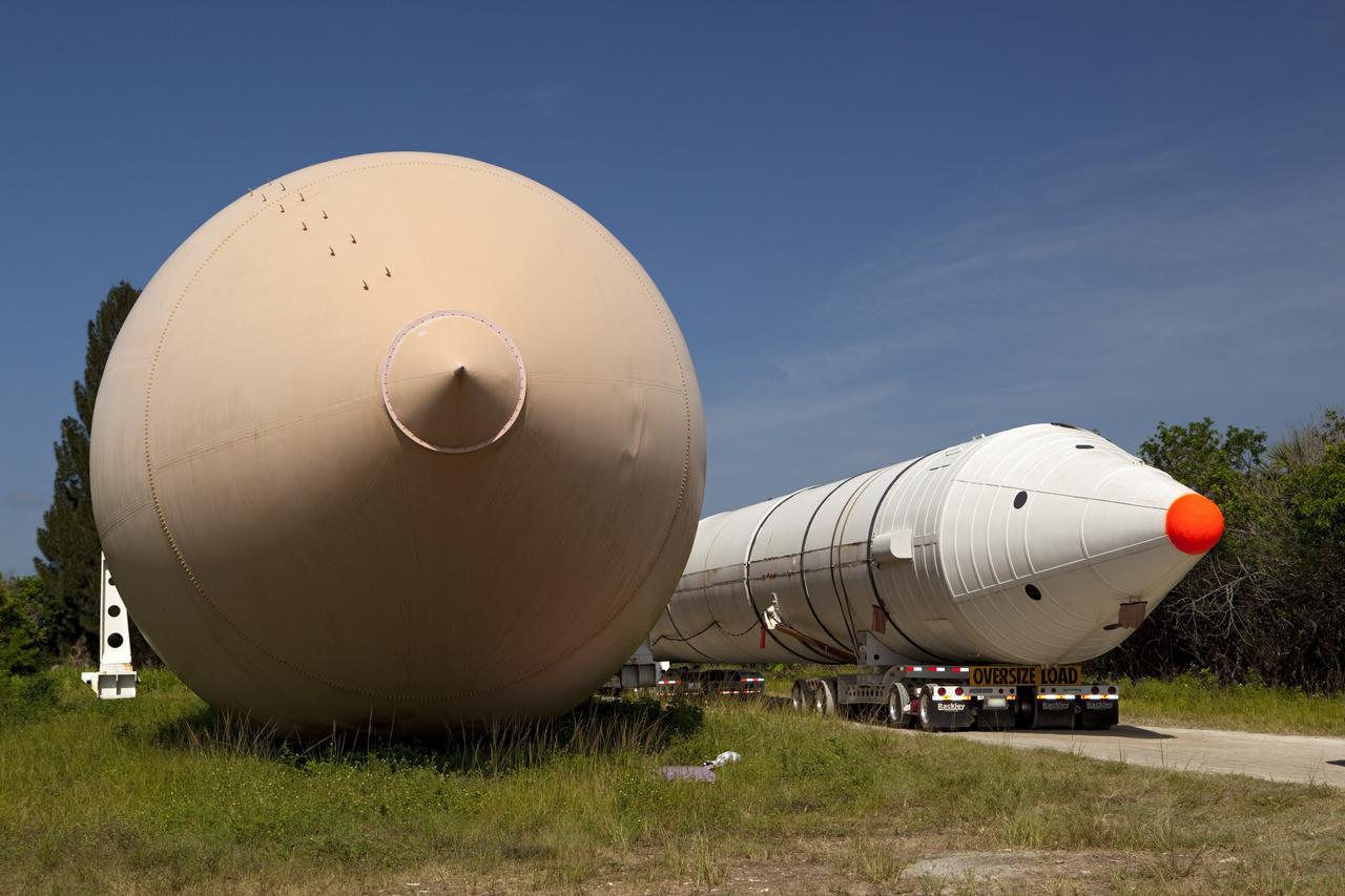 CAPE CANAVERAL, Fla. – At NASA’s Kennedy Space Center in Florida, a space shuttle solid rocket booster and an external fuel tank are being prepared for transport to separate museums.      The solid rocket boosters, or SRBs, will be displayed at the California Science Center in Los Angeles. The external tank soon will be transported for display at the Wings of Dreams Aviation Museum at Keystone Heights Airport between Gainesville and Jacksonville, Fla. The 149-foot SRBs together provided six million pounds of thrust. The external fuel tank contained over 500,000 gallons of liquid hydrogen and liquid oxygen propellant for the shuttle orbiters' three main engines. The work is part of Transition and Retirement of the space shuttle. For more information, visit http://www.nasa.gov/transition Photo credit: NASA/ Dimitri Gerondidakis