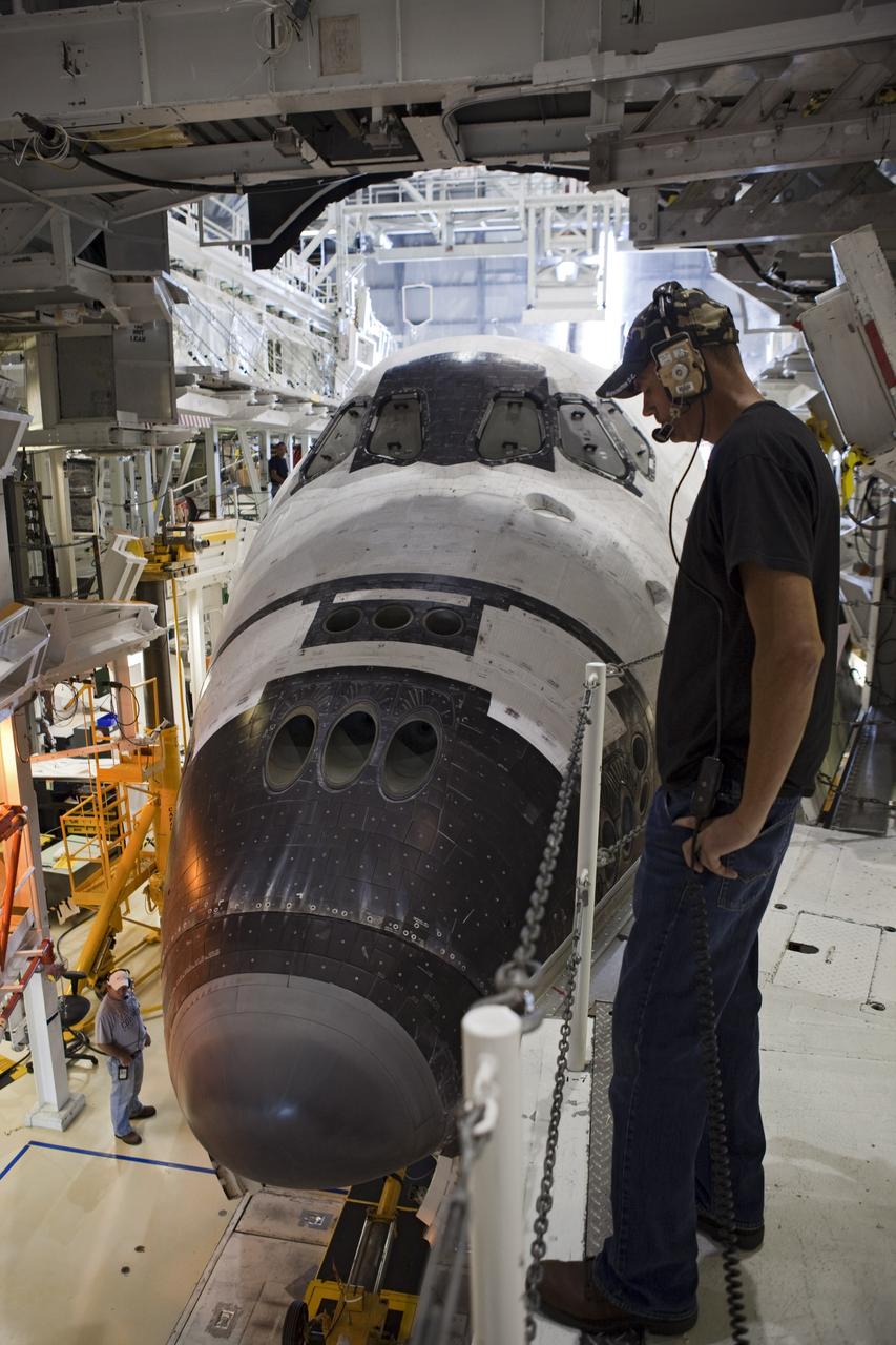 CAPE CANAVERAL, Fla. – A United Space Alliance technician monitors the space shuttle Endeavour as it backs out of Bay 2 of the Orbiter Processing Facility at the Kennedy Space Center in Florida. Endeavour will be moved to the Vehicle Assembly Building to undergo final preparations for its cross-country ferry flight targeted for mid-September. The work is part of Transition and Retirement of the remaining space shuttles, Endeavour and Atlantis. Endeavour is being prepared for public display at the California Science Center in Los Angeles. Endeavour was the last space shuttle added to NASA’s orbiter fleet. Over the course of its 19-year career, Endeavour spent 299 days in space during 25 missions. For more information, visit http://www.nasa.gov/transition. Photo credit: NASA/Dimitri Gerondidakis
