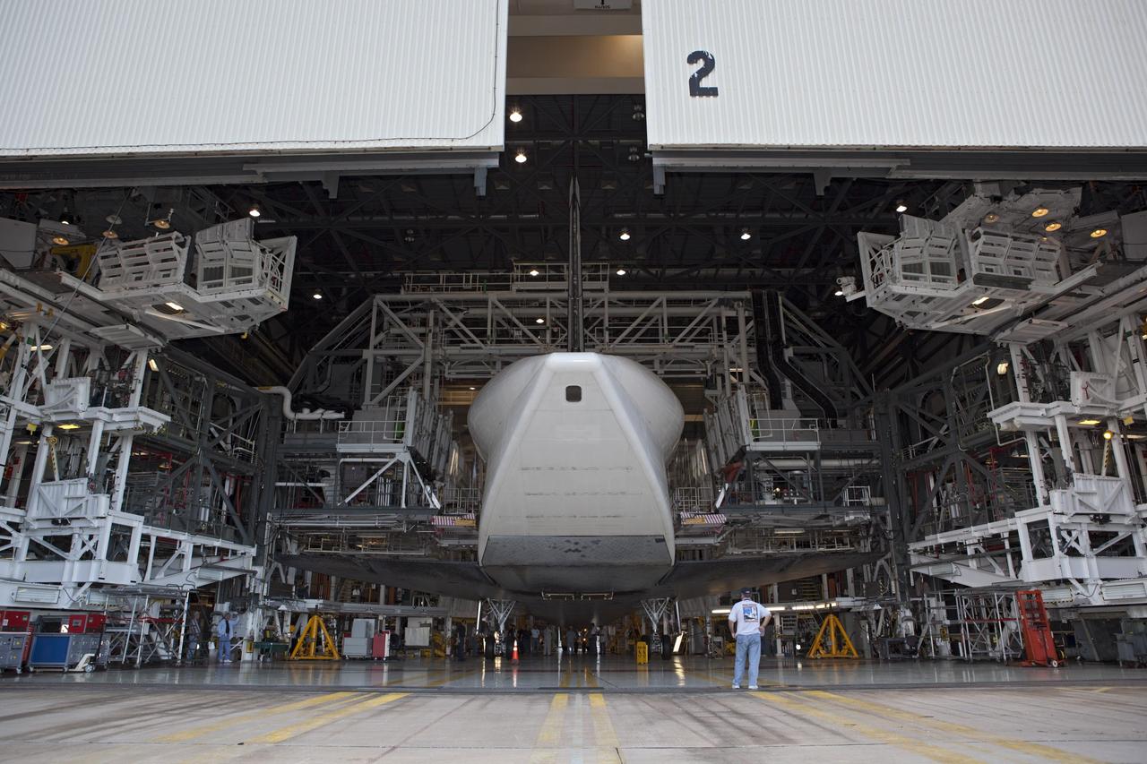 CAPE CANAVERAL, Fla. – The space shuttle Endeavour backs out of Bay 2 of the Orbiter Processing Facility at the Kennedy Space Center in Florida. Endeavour will be moved to the Vehicle Assembly Building to undergo final preparations for its cross-country ferry flight targeted for mid-September. The work is part of Transition and Retirement of the remaining space shuttles, Endeavour and Atlantis. Endeavour is being prepared for public display at the California Science Center in Los Angeles. Endeavour was the last space shuttle added to NASA’s orbiter fleet. Over the course of its 19-year career, Endeavour spent 299 days in space during 25 missions. For more information, visit http://www.nasa.gov/transition. Photo credit: NASA/Dimitri Gerondidakis
