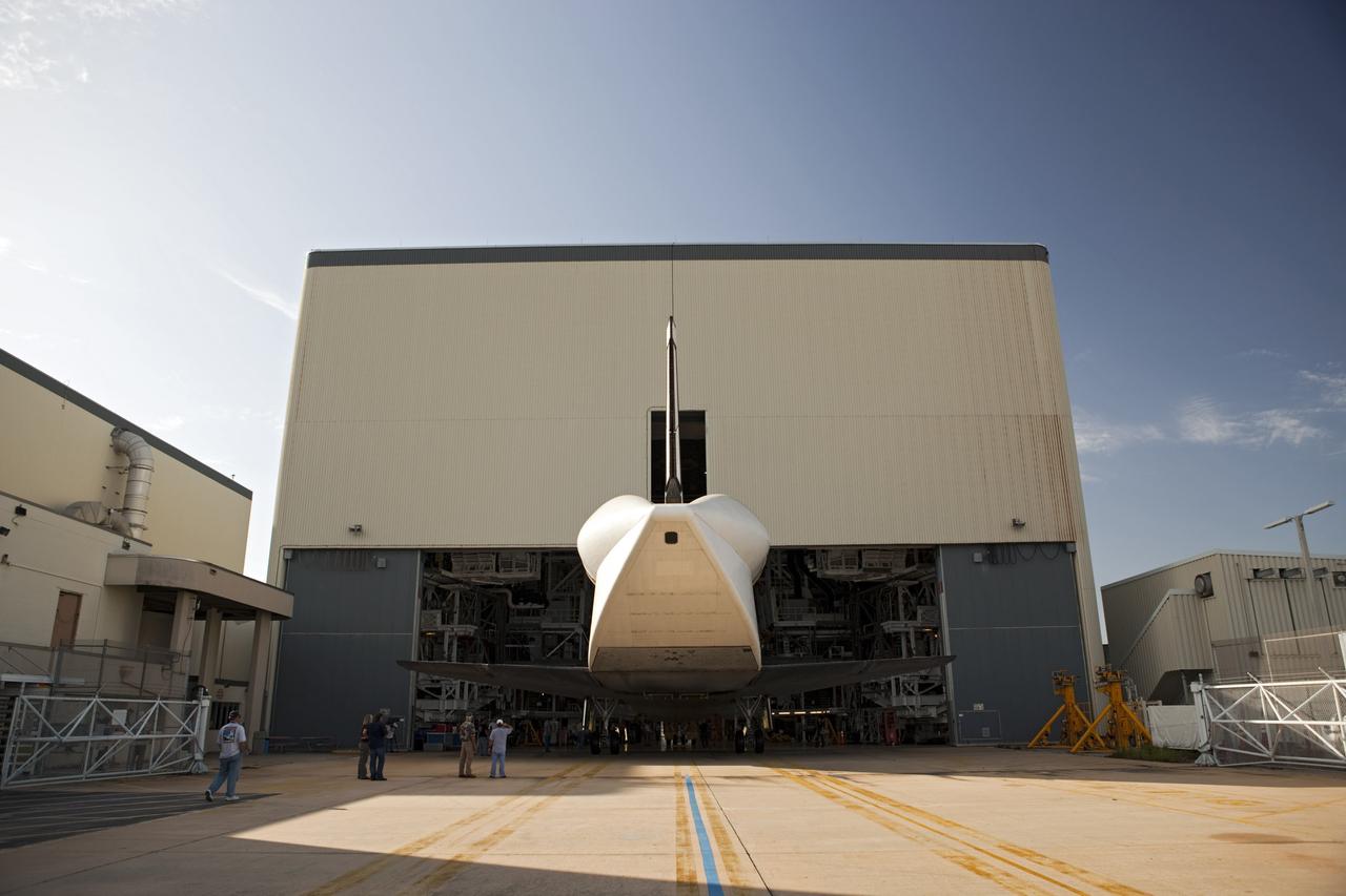 CAPE CANAVERAL, Fla. – With its aerodynamic tail cone in place, the space shuttle Endeavour backs out of Bay 2 of the Orbiter Processing Facility at the Kennedy Space Center in Florida. Endeavour will be moved to the Vehicle Assembly Building to undergo final preparations for its cross-country ferry flight targeted for mid-September. The work is part of Transition and Retirement of the remaining space shuttles, Endeavour and Atlantis. Endeavour is being prepared for public display at the California Science Center in Los Angeles. Endeavour was the last space shuttle added to NASA’s orbiter fleet. Over the course of its 19-year career, Endeavour spent 299 days in space during 25 missions. For more information, visit http://www.nasa.gov/transition. Photo credit: NASA/Dimitri Gerondidakis
