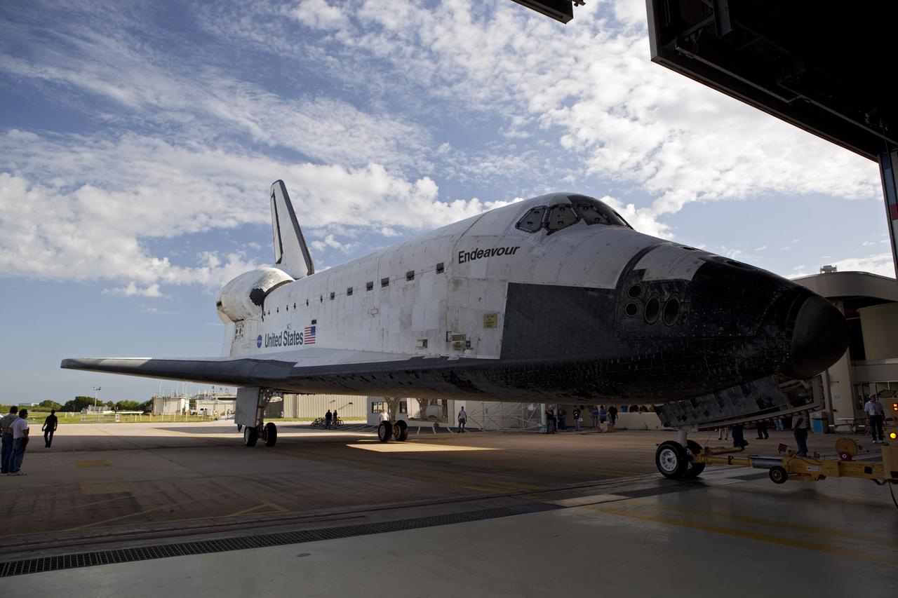 CAPE CANAVERAL, Fla. – The space shuttle Endeavour backs through the doors of Bay 2 of the Orbiter Processing Facility at the Kennedy Space Center in Florida. Endeavour will be moved to the Vehicle Assembly Building to undergo final preparations for its cross-country ferry flight targeted for mid-September. The work is part of Transition and Retirement of the remaining space shuttles, Endeavour and Atlantis. Endeavour is being prepared for public display at the California Science Center in Los Angeles. Endeavour was the last space shuttle added to NASA’s orbiter fleet. Over the course of its 19-year career, Endeavour spent 299 days in space during 25 missions. For more information, visit http://www.nasa.gov/transition. Photo credit: NASA/Dimitri Gerondidakis