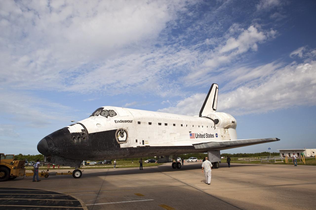 CAPE CANAVERAL, Fla. – The space shuttle Endeavour moves clear of the doors to Bay 2 of the Orbiter Processing Facility at the Kennedy Space Center in Florida. Endeavour will be moved to the Vehicle Assembly Building to undergo final preparations for its cross-country ferry flight targeted for mid-September. The work is part of Transition and Retirement of the remaining space shuttles, Endeavour and Atlantis. Endeavour is being prepared for public display at the California Science Center in Los Angeles. Endeavour was the last space shuttle added to NASA’s orbiter fleet. Over the course of its 19-year career, Endeavour spent 299 days in space during 25 missions. For more information, visit http://www.nasa.gov/transition. Photo credit: NASA/Dimitri Gerondidakis