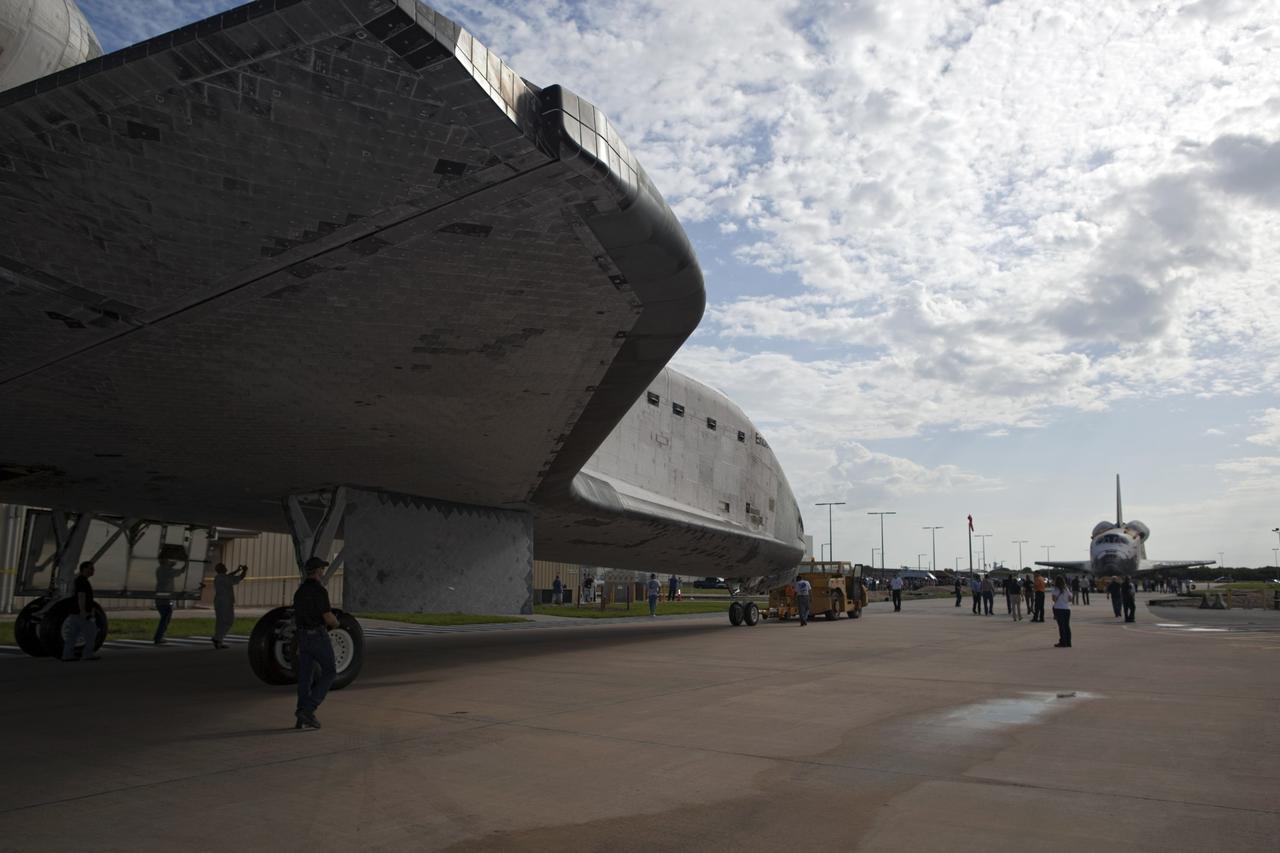 CAPE CANAVERAL, Fla. – The space shuttle Endeavour approaches sister shuttle Atlantis for a brief photo opportunity at the Kennedy Space Center in Florida. Endeavour moved from Bay 2 of the Orbiter Processing Facility to switch places with Atlantis which had been in Vehicle Assembly Building VAB. In the VAB, Endeavour will undergo final preparations for its cross-country ferry flight targeted for mid-September. The work is part of Transition and Retirement of the remaining space shuttles, Endeavour and Atlantis. Endeavour is being prepared for public display at the California Science Center in Los Angeles. Endeavour was the last space shuttle added to NASA’s orbiter fleet. Over the course of its 19-year career, Endeavour spent 299 days in space during 25 missions. For more information, visit http://www.nasa.gov/transition Photo credit: NASA/Dimitri Gerondidakis