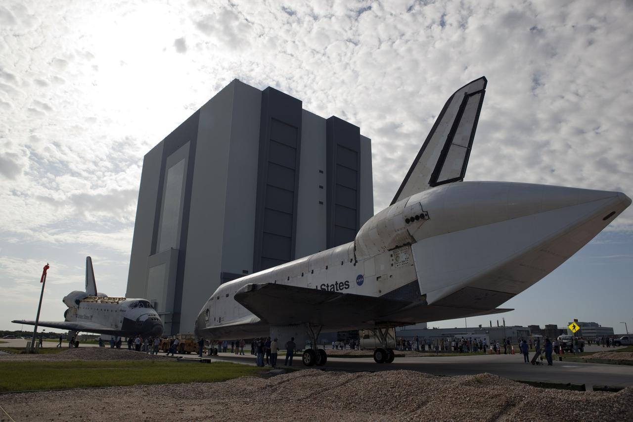 CAPE CANAVERAL, Fla. – The space shuttle Endeavour meets sister shuttle Atlantis in the background for a brief photo opportunity at the Kennedy Space Center in Florida. Endeavour moved from Bay 2 of the Orbiter Processing Facility to switch places with Atlantis which had been in Vehicle Assembly Building VAB. In the VAB, Endeavour will undergo final preparations for its cross-country ferry flight targeted for mid-September. The work is part of Transition and Retirement of the remaining space shuttles, Endeavour and Atlantis. Endeavour is being prepared for public display at the California Science Center in Los Angeles. Endeavour was the last space shuttle added to NASA’s orbiter fleet. Over the course of its 19-year career, Endeavour spent 299 days in space during 25 missions. For more information, visit http://www.nasa.gov/transition Photo credit: NASA/Dimitri Gerondidakis