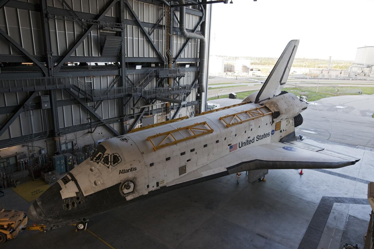 CAPE CANAVERAL, Fla. – The space shuttle Atlantis begins backing out of the Vehicle Assembly Building at NASA's Kennedy Space Center in Florida. Atlantis is switching places with Endeavour which had been in Bay 2 of the Orbiter Processing Facility OPF. In the OPF, Atlantis will undergo final preparations for its transfer to the Kennedy Space Center Visitor Complex targeted for November. The work is part of Transition and Retirement of the remaining space shuttles, Atlantis and Endeavour. Atlantis is being prepared for public display at Kennedy's Visitor Complex. Over the course of its 26-year career, Atlantis spent 293 days in space during 33 missions. For more information, visit http://www.nasa.gov/transition Photo credit: NASA/Kim Shiflett