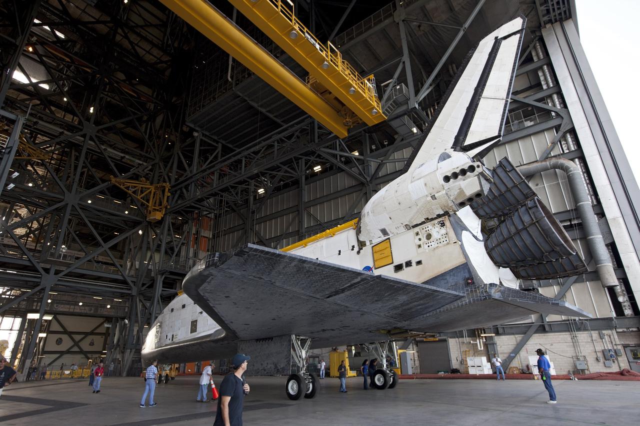 CAPE CANAVERAL, Fla. – United Space Alliance technicians monitor the space shuttle Atlantis as it begins backing out of the Vehicle Assembly Building at NASA's Kennedy Space Center in Florida. Atlantis is switching places with Endeavour which had been in Bay 2 of the Orbiter Processing Facility OPF. In the OPF, Atlantis will undergo final preparations for its transfer to the Kennedy Space Center Visitor Complex targeted for November. The work is part of Transition and Retirement of the remaining space shuttles, Atlantis and Endeavour. Atlantis is being prepared for public display at Kennedy's Visitor Complex. Over the course of its 26-year career, Atlantis spent 293 days in space during 33 missions. For more information, visit http://www.nasa.gov/transition Photo credit: NASA/Kim Shiflett