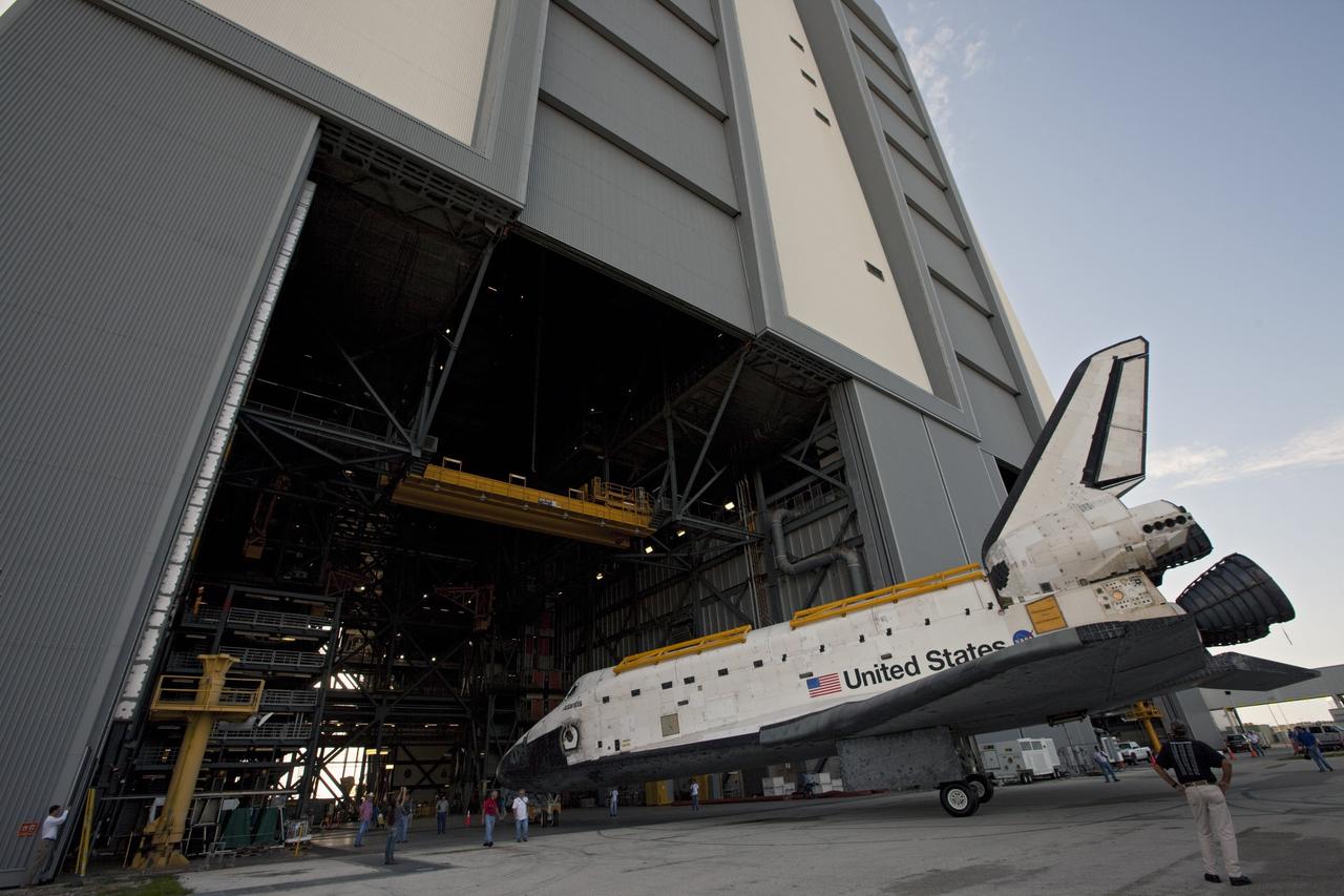 CAPE CANAVERAL, Fla. – United Space Alliance technicians monitor the space shuttle Atlantis as it begins backing out of the Vehicle Assembly Building at NASA's Kennedy Space Center in Florida. Atlantis is switching places with Endeavour which had been in Bay 2 of the Orbiter Processing Facility OPF. In the OPF, Atlantis will undergo final preparations for its transfer to the Kennedy Space Center Visitor Complex targeted for November. The work is part of Transition and Retirement of the remaining space shuttles, Atlantis and Endeavour. Atlantis is being prepared for public display at Kennedy's Visitor Complex. Over the course of its 26-year career, Atlantis spent 293 days in space during 33 missions. For more information, visit http://www.nasa.gov/transition Photo credit: NASA/Kim Shiflett