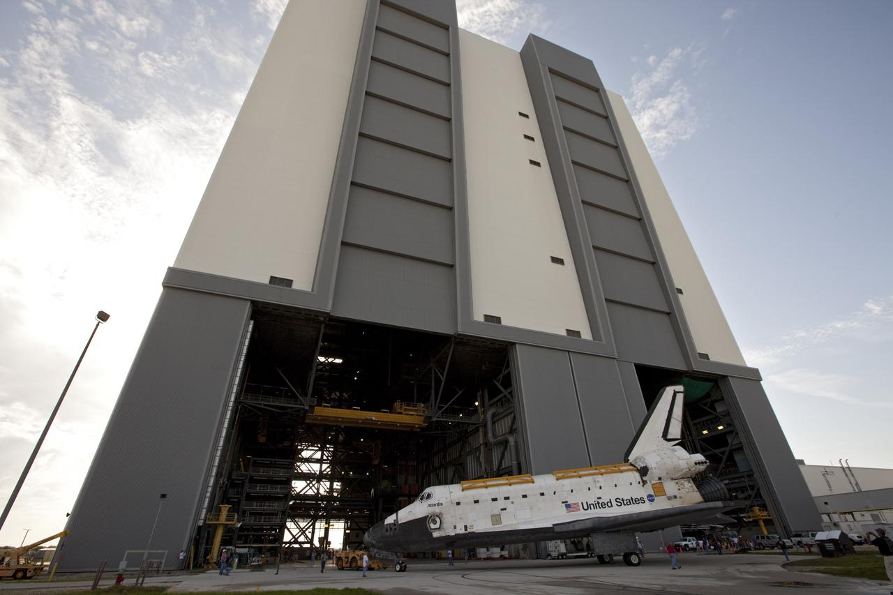 CAPE CANAVERAL, Fla. – The space shuttle Atlantis begins backing out of the 525-foot-tall Vehicle Assembly Building at NASA's Kennedy Space Center in Florida. Atlantis is switching places with Endeavour which had been in Bay 2 of the Orbiter Processing Facility OPF. In the OPF, Atlantis will undergo final preparations for its transfer to the Kennedy Space Center Visitor Complex targeted for November. The work is part of Transition and Retirement of the remaining space shuttles, Atlantis and Endeavour. Atlantis is being prepared for public display at Kennedy's Visitor Complex. Over the course of its 26-year career, Atlantis spent 293 days in space during 33 missions. For more information, visit http://www.nasa.gov/transition Photo credit: NASA/Kim Shiflett