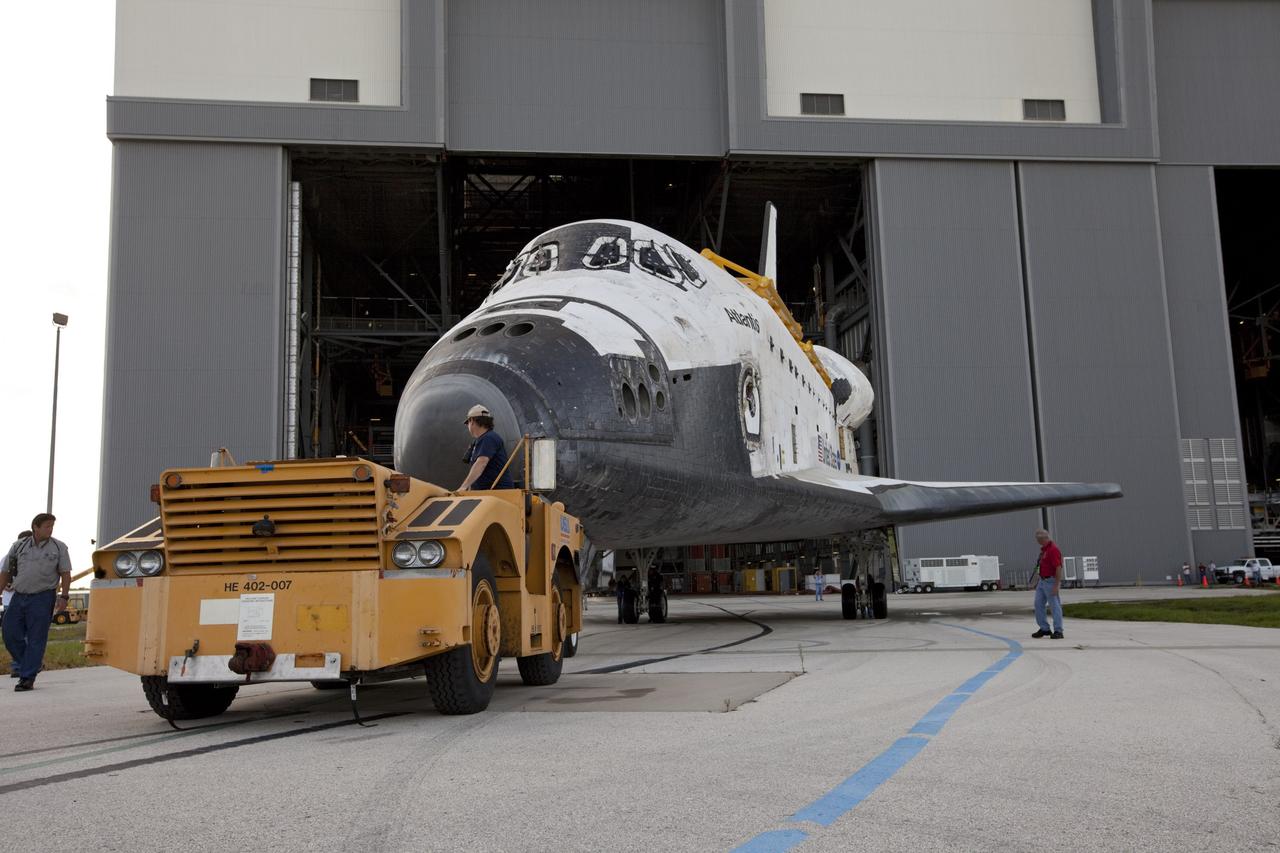 CAPE CANAVERAL, Fla. – The space shuttle Atlantis is towed away from the Vehicle Assembly Building at NASA's Kennedy Space Center in Florida. Atlantis is switching places with Endeavour which had been in Bay 2 of the Orbiter Processing Facility OPF. In the OPF, Atlantis will undergo final preparations for its transfer to the Kennedy Space Center Visitor Complex targeted for November. The work is part of Transition and Retirement of the remaining space shuttles, Atlantis and Endeavour. Atlantis is being prepared for public display at Kennedy's Visitor Complex. Over the course of its 26-year career, Atlantis spent 293 days in space during 33 missions. For more information, visit http://www.nasa.gov/transition Photo credit: NASA/Kim Shiflett