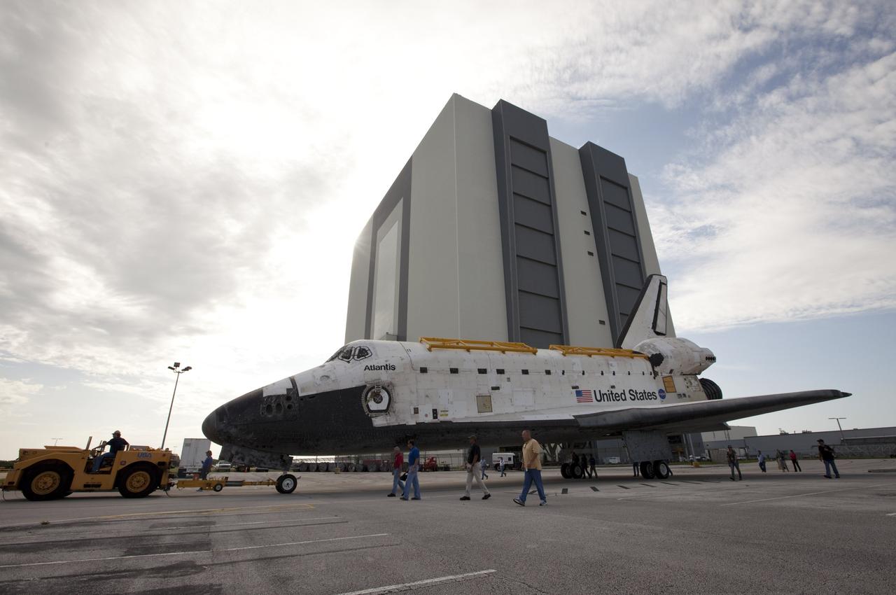 CAPE CANAVERAL, Fla. – The space shuttle Atlantis is towed away from the Vehicle Assembly Building at NASA's Kennedy Space Center in Florida. Atlantis is switching places with Endeavour which had been in Bay 2 of the Orbiter Processing Facility OPF. In the OPF, Atlantis will undergo final preparations for its transfer to the Kennedy Space Center Visitor Complex targeted for November. The work is part of Transition and Retirement of the remaining space shuttles, Atlantis and Endeavour. Atlantis is being prepared for public display at Kennedy's Visitor Complex. Over the course of its 26-year career, Atlantis spent 293 days in space during 33 missions. For more information, visit http://www.nasa.gov/transition Photo credit: NASA/Kim Shiflett