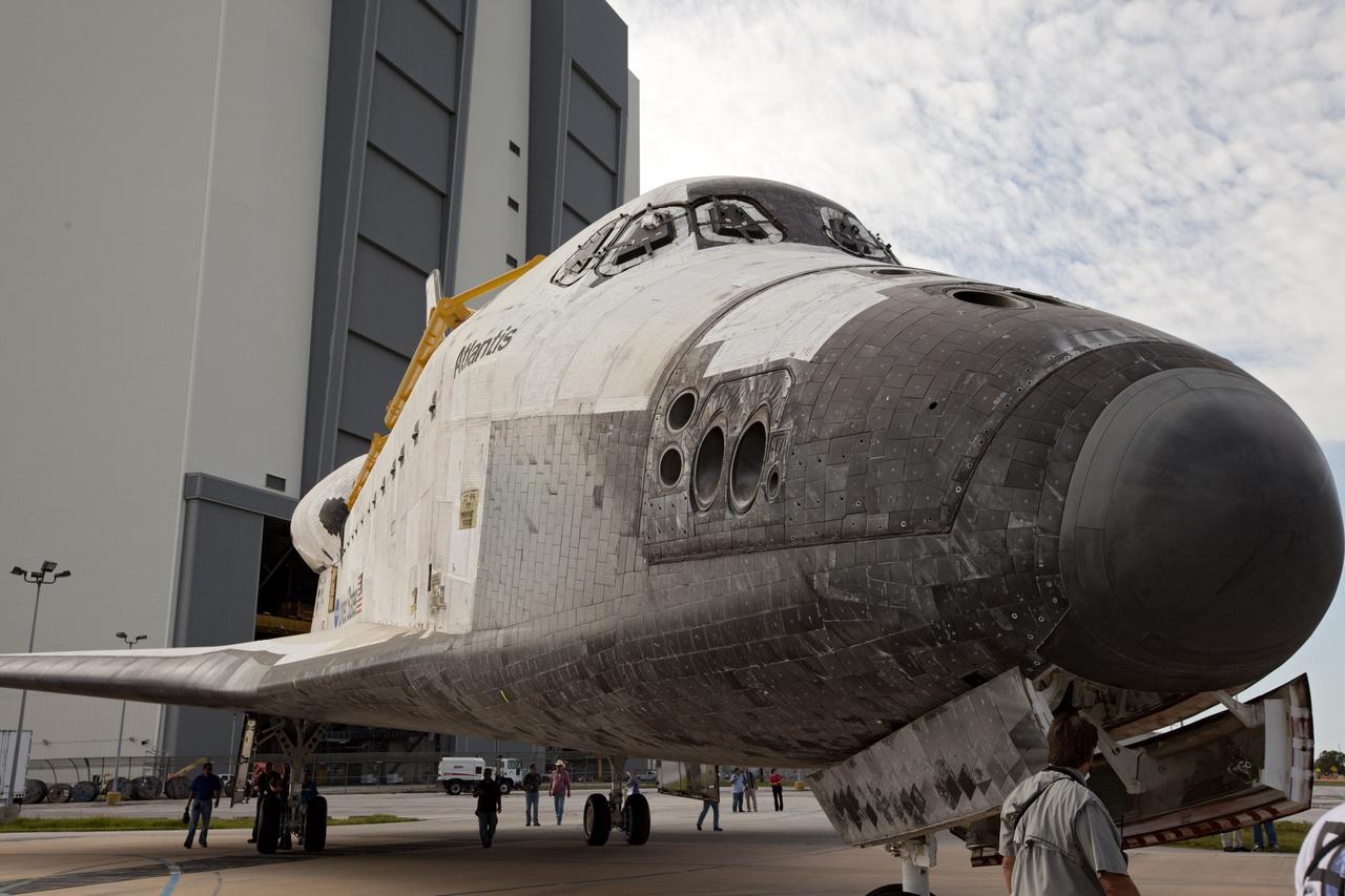 CAPE CANAVERAL, Fla. – The space shuttle Atlantis is towed away from the Vehicle Assembly Building at NASA's Kennedy Space Center in Florida. Atlantis is switching places with Endeavour which had been in Bay 2 of the Orbiter Processing Facility OPF. In the OPF, Atlantis will undergo final preparations for its transfer to the Kennedy Space Center Visitor Complex targeted for November. The work is part of Transition and Retirement of the remaining space shuttles, Atlantis and Endeavour. Atlantis is being prepared for public display at Kennedy's Visitor Complex. Over the course of its 26-year career, Atlantis spent 293 days in space during 33 missions. For more information, visit http://www.nasa.gov/transition Photo credit: NASA/Kim Shiflett