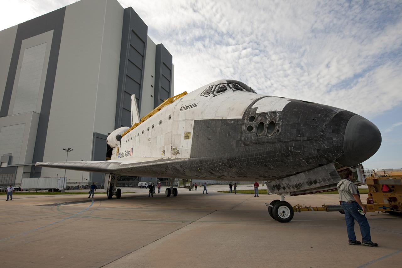 CAPE CANAVERAL, Fla. – The space shuttle Atlantis is towed away from the Vehicle Assembly Building at NASA's Kennedy Space Center in Florida. Atlantis is switching places with Endeavour which had been in Bay 2 of the Orbiter Processing Facility OPF. In the OPF, Atlantis will undergo final preparations for its transfer to the Kennedy Space Center Visitor Complex targeted for November. The work is part of Transition and Retirement of the remaining space shuttles, Atlantis and Endeavour. Atlantis is being prepared for public display at Kennedy's Visitor Complex. Over the course of its 26-year career, Atlantis spent 293 days in space during 33 missions. For more information, visit http://www.nasa.gov/transition Photo credit: NASA/Kim Shiflett