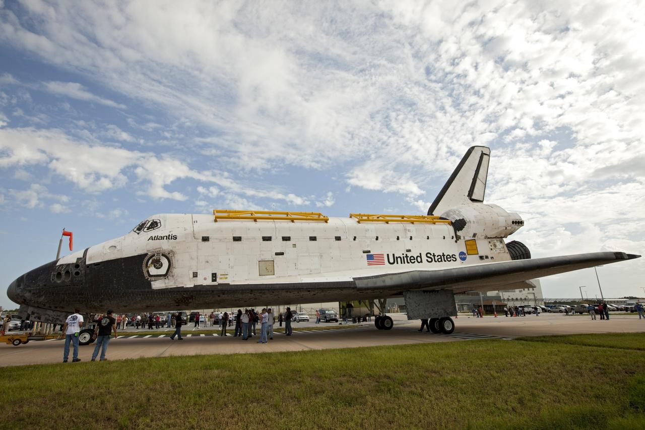 CAPE CANAVERAL, Fla. – The space shuttle Atlantis is towed from the Vehicle Assembly Building at NASA's Kennedy Space Center in Florida. Atlantis is switching places with Endeavour which had been in Bay 2 of the Orbiter Processing Facility OPF. In the OPF, Atlantis will undergo final preparations for its transfer to the Kennedy Space Center Visitor Complex targeted for November. The work is part of Transition and Retirement of the remaining space shuttles, Atlantis and Endeavour. Atlantis is being prepared for public display at Kennedy's Visitor Complex. Over the course of its 26-year career, Atlantis spent 293 days in space during 33 missions. For more information, visit http://www.nasa.gov/transition Photo credit: NASA/Kim Shiflett