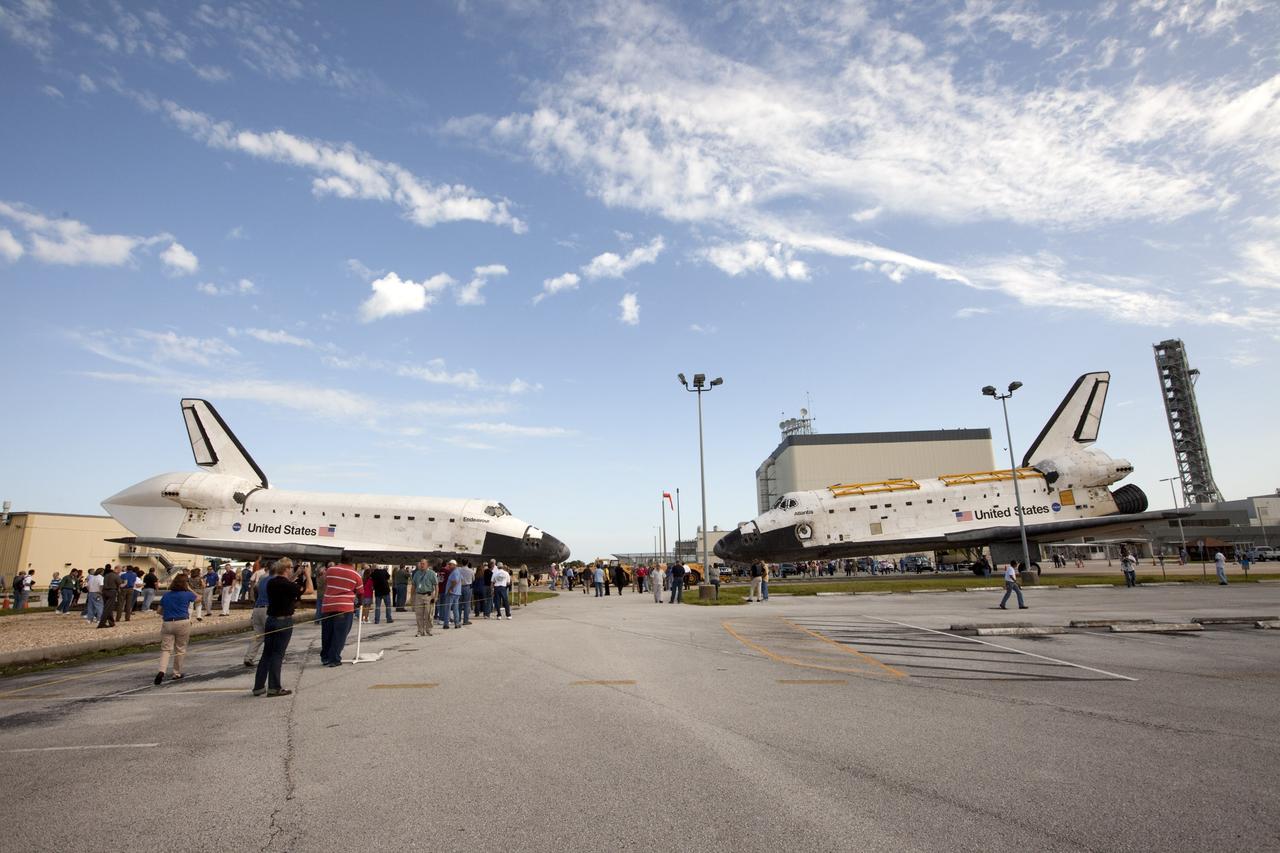 CAPE CANAVERAL, Fla. – Employees at NASA's Kennedy Space Center in Florida watch as the space shuttle Atlantis is towed from the Vehicle Assembly Building. Atlantis is switching places with Endeavour which had been in Bay 2 of the Orbiter Processing Facility OPF. In the OPF, Atlantis will undergo final preparations for its transfer to the Kennedy Space Center Visitor Complex targeted for November. The work is part of Transition and Retirement of the remaining space shuttles, Atlantis and Endeavour. Atlantis is being prepared for public display at Kennedy's Visitor Complex. Over the course of its 26-year career, Atlantis spent 293 days in space during 33 missions. For more information, visit http://www.nasa.gov/transition Photo credit: NASA/Kim Shiflett
