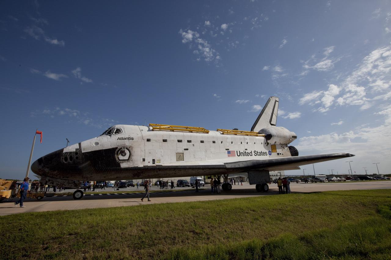 CAPE CANAVERAL, Fla. – The space shuttle Atlantis is towed from the Vehicle Assembly Building at NASA's Kennedy Space Center in Florida. Atlantis is switching places with Endeavour which had been in Bay 2 of the Orbiter Processing Facility OPF. In the OPF, Atlantis will undergo final preparations for its transfer to the Kennedy Space Center Visitor Complex targeted for November. The work is part of Transition and Retirement of the remaining space shuttles, Atlantis and Endeavour. Atlantis is being prepared for public display at Kennedy's Visitor Complex. Over the course of its 26-year career, Atlantis spent 293 days in space during 33 missions. For more information, visit http://www.nasa.gov/transition Photo credit: NASA/Kim Shiflett