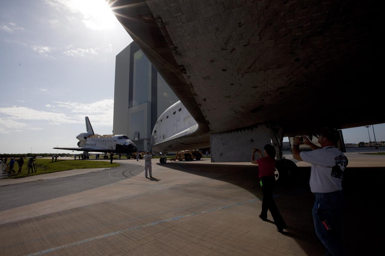CAPE CANAVERAL, Fla. – The space shuttle Endeavour meets sister shuttle Atlantis in the background for a brief photo opportunity at NASA's Kennedy Space Center in Florida. Endeavour moved from Bay 2 of the Orbiter Processing Facility OPF to switch places with Atlantis which had been in. In the OPF, Atlantis will undergo final preparations for its transfer to the Kennedy Space Center Visitor Complex targeted for November. The work is part of Transition and Retirement of the remaining space shuttles, Atlantis and Endeavour. Atlantis is being prepared for public display at Kennedy's Visitor Complex. Over the course of its 26-year career, Atlantis spent 293 days in space during 33 missions. For more information, visit http://www.nasa.gov/transition Photo credit: NASA/Kim Shiflett