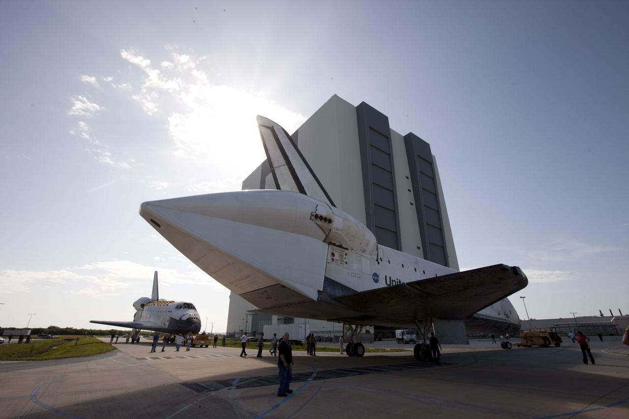 CAPE CANAVERAL, Fla. – The space shuttle Endeavour moves away from sister shuttle Atlantis in the background following a brief photo opportunity at the Kennedy Space Center in Florida. Endeavour moved from Bay 2 of the Orbiter Processing Facility OPF to switch places with Atlantis which had been in the Vehicle Assembly Building. In the OPF, Atlantis will undergo final preparations for its transfer to the Kennedy Space Center Visitor Complex targeted for November. The work is part of Transition and Retirement of the remaining space shuttles, Atlantis and Endeavour. Atlantis is being prepared for public display at Kennedy's Visitor Complex. Over the course of its 26-year career, Atlantis spent 293 days in space during 33 missions. For more information, visit http://www.nasa.gov/transition Photo credit: NASA/Kim Shiflett