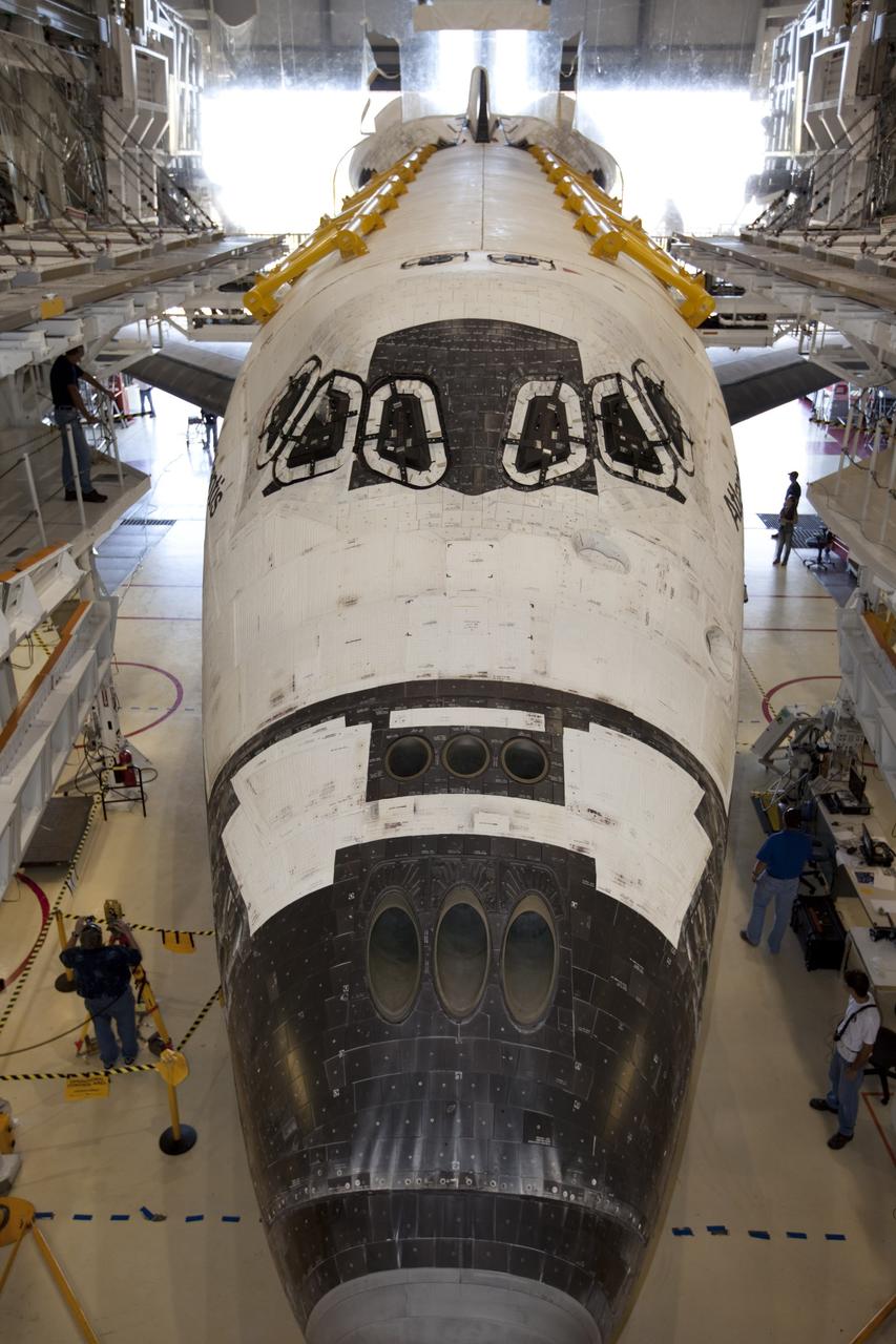CAPE CANAVERAL, Fla. – This wide-angle view shows the space shuttle Atlantis as it enters Bay 2 of the Orbiter Processing Facility OPF at NASA's Kennedy Space Center in Florida. Atlantis is switching places with Endeavour that moved into the Vehicle Assembly Building. In the OPF, Atlantis will undergo final preparations for its transfer to the Kennedy Space Center Visitor Complex targeted for November. The work is part of Transition and Retirement of the remaining space shuttles, Atlantis and Endeavour. Atlantis is being prepared for public display at Kennedy's Visitor Complex. Over the course of its 26-year career, Atlantis spent 293 days in space during 33 missions. For more information, visit http://www.nasa.gov/transition Photo credit: NASA/Kim Shiflett