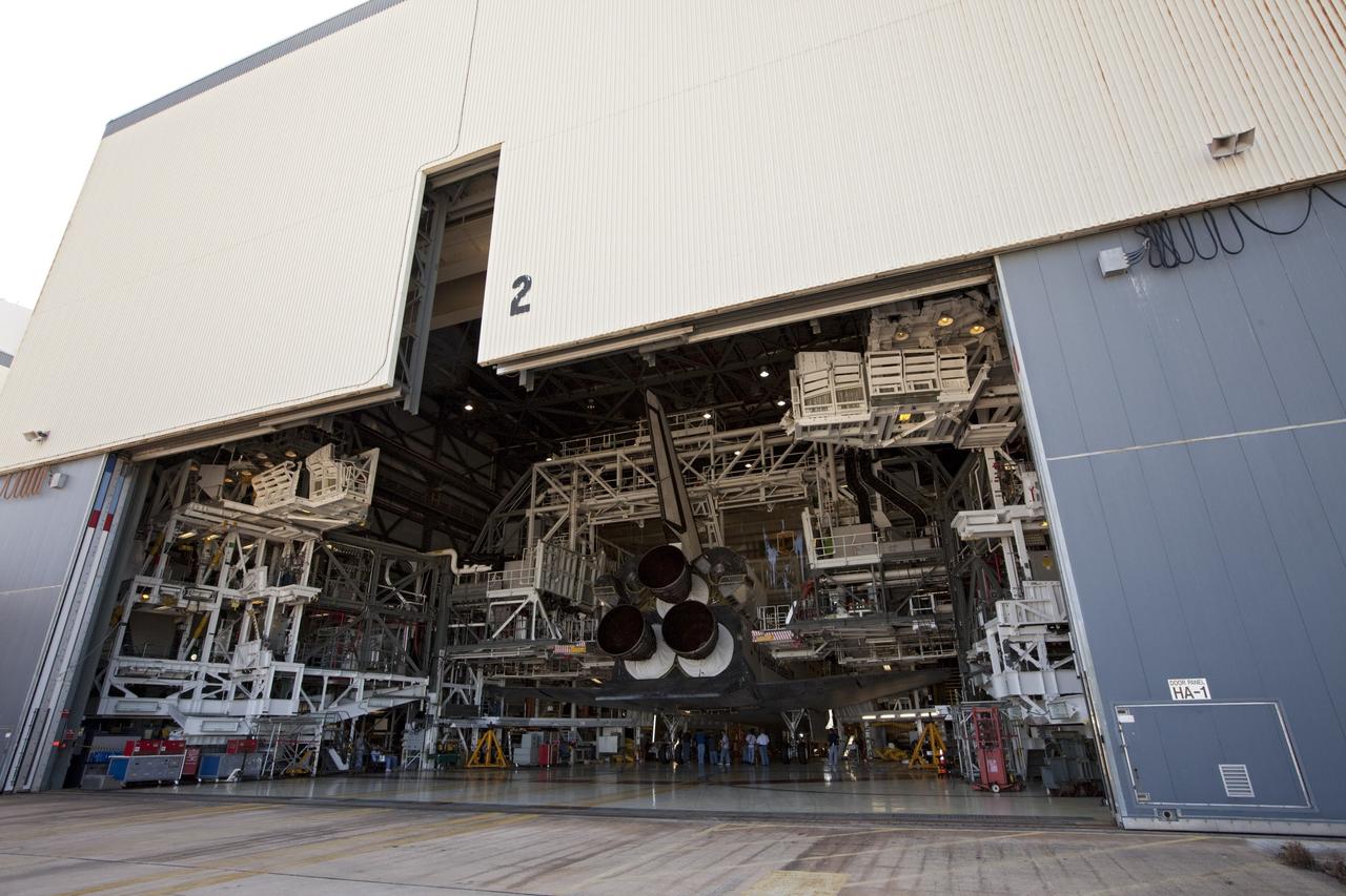 CAPE CANAVERAL, Fla. – The space shuttle Atlantis completes its move into Bay 2 of the Orbiter Processing Facility OPF at NASA's Kennedy Space Center in Florida. Atlantis switched places with Endeavour that moved into the Vehicle Assembly Building. In the OPF, Atlantis will undergo final preparations for its transfer to the Kennedy Space Center Visitor Complex targeted for November. The work is part of Transition and Retirement of the remaining space shuttles, Atlantis and Endeavour. Atlantis is being prepared for public display at Kennedy's Visitor Complex. Over the course of its 26-year career, Atlantis spent 293 days in space during 33 missions. For more information, visit http://www.nasa.gov/transition Photo credit: NASA/Kim Shiflett